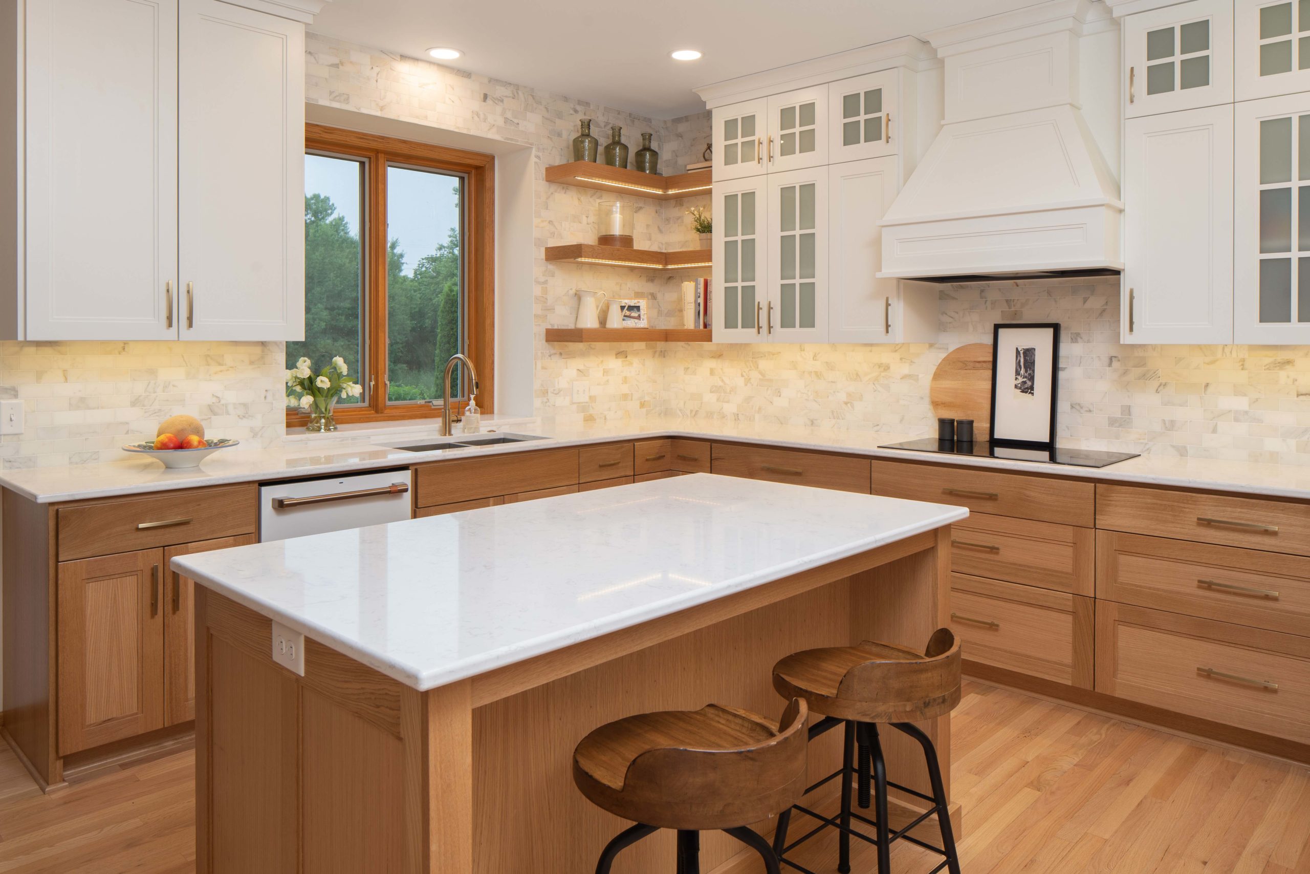 A kitchen with wood cabinets and a center island undergoing a kitchen remodel.
