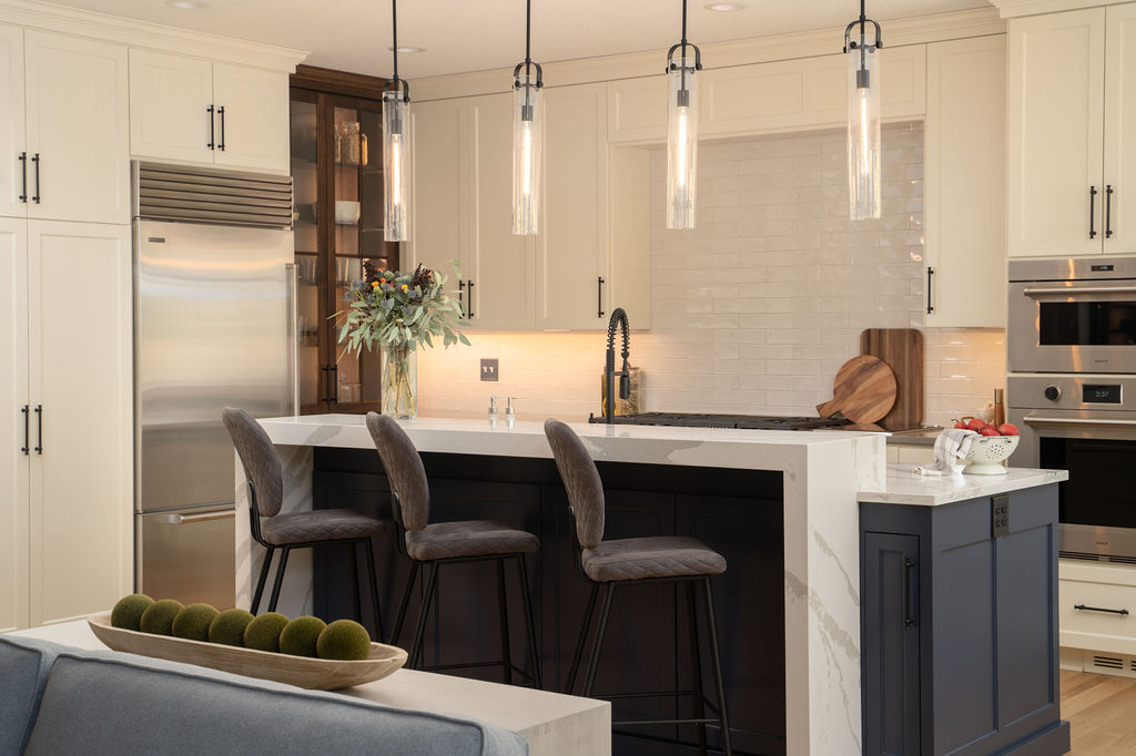 An Edina remodel with white cabinets and bar stools.