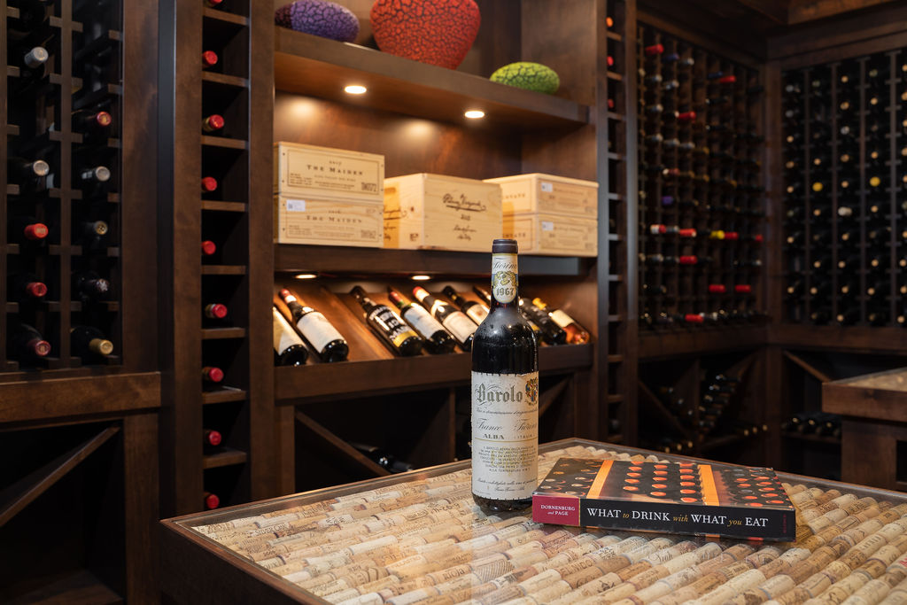 A wine cellar in Edina with a bottle of wine on a table.
