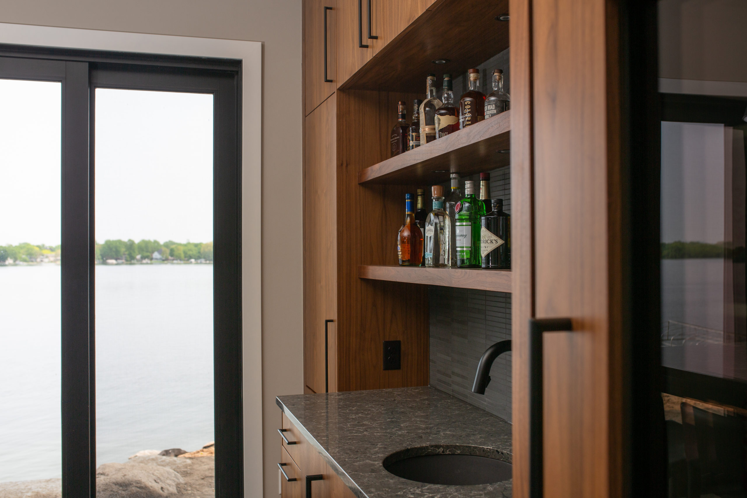 A kitchen with a view of the water.