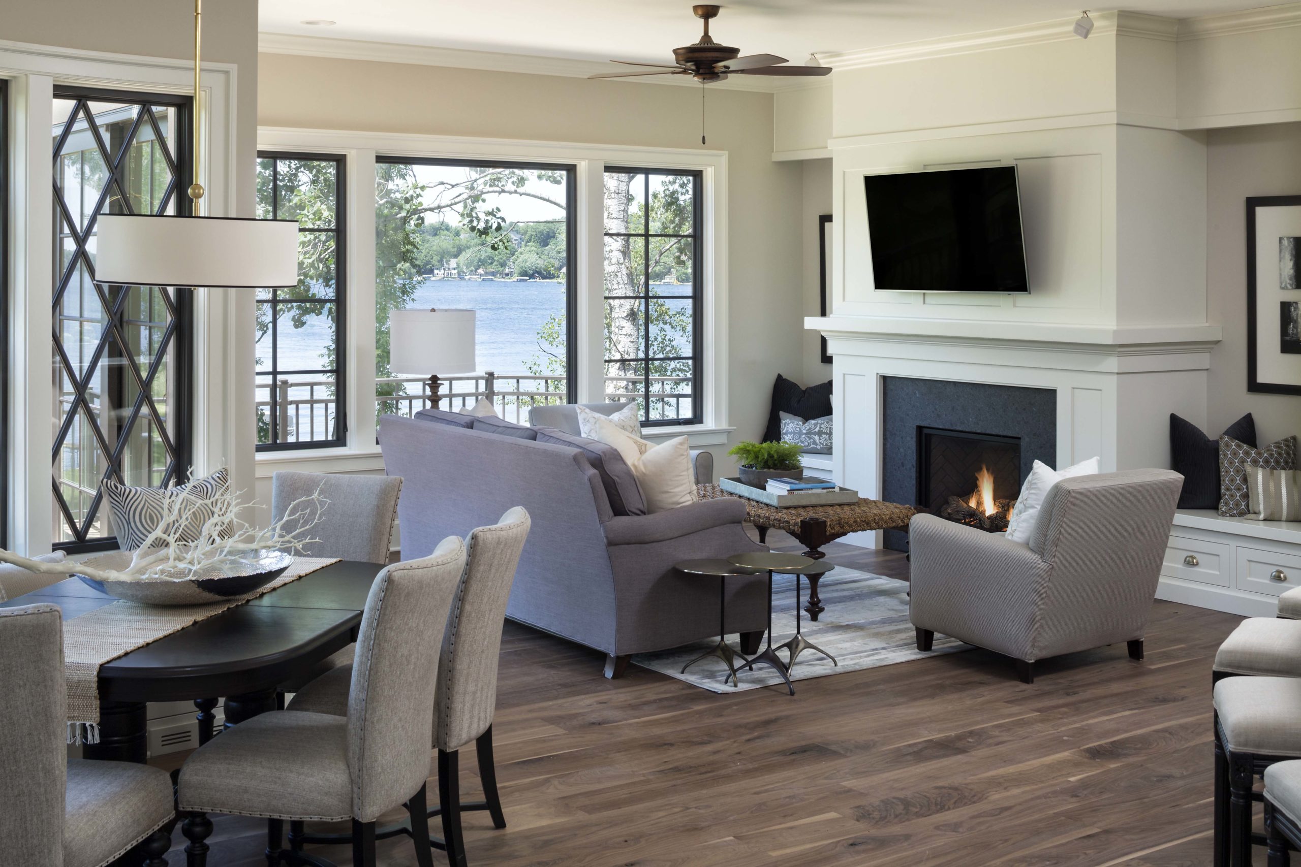 A living room with hardwood floors and a fireplace.