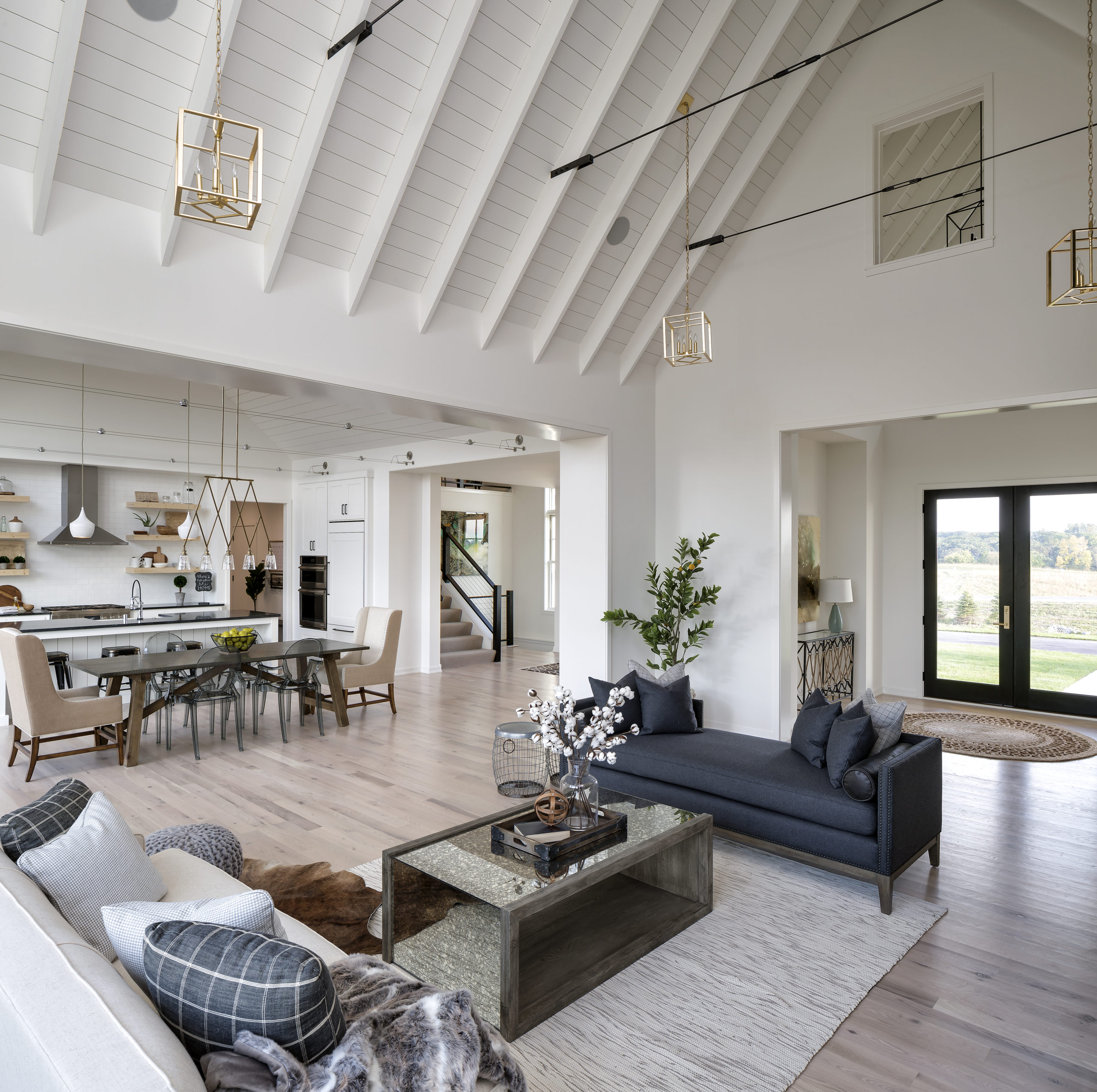 A large open living room with vaulted ceilings.