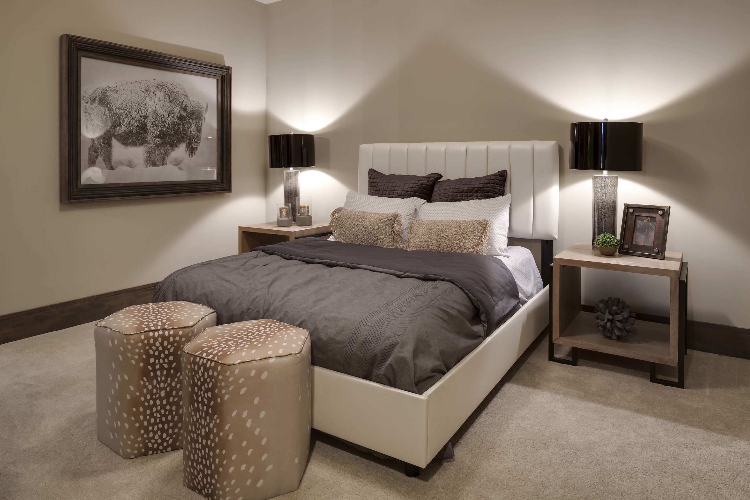 Taupe bedroom with dark brown and cream bedding, contemporary wood nightstands and accessorized by Ruby and Suede.