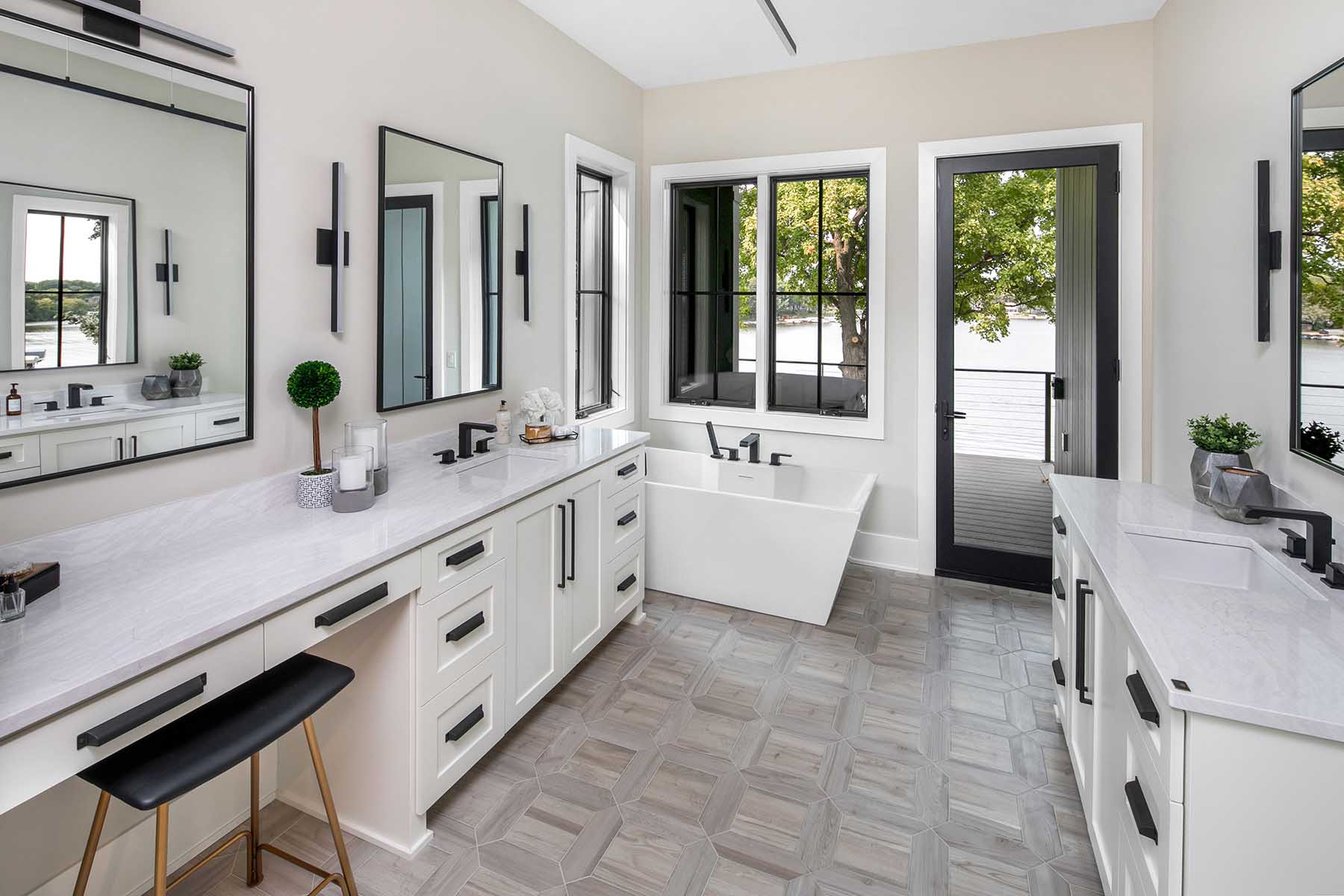 A white bathroom with a large mirror and sink.