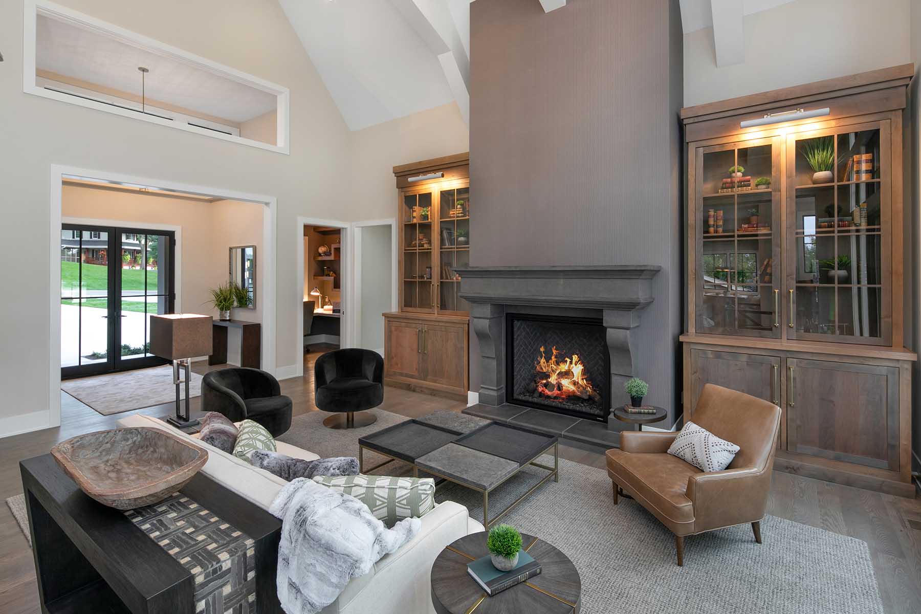 A large living room with a fireplace.