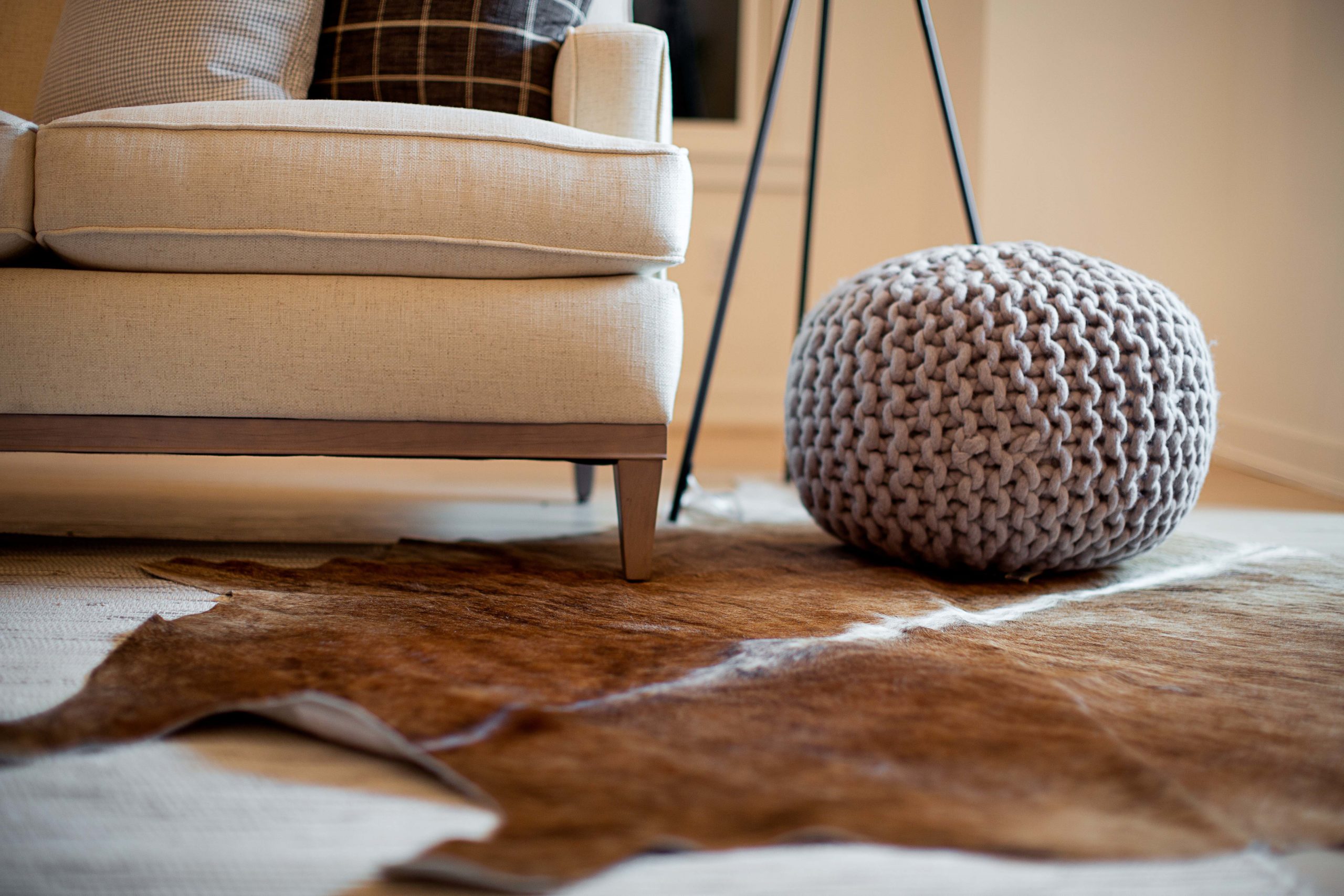 A cowhide rug in a living room.