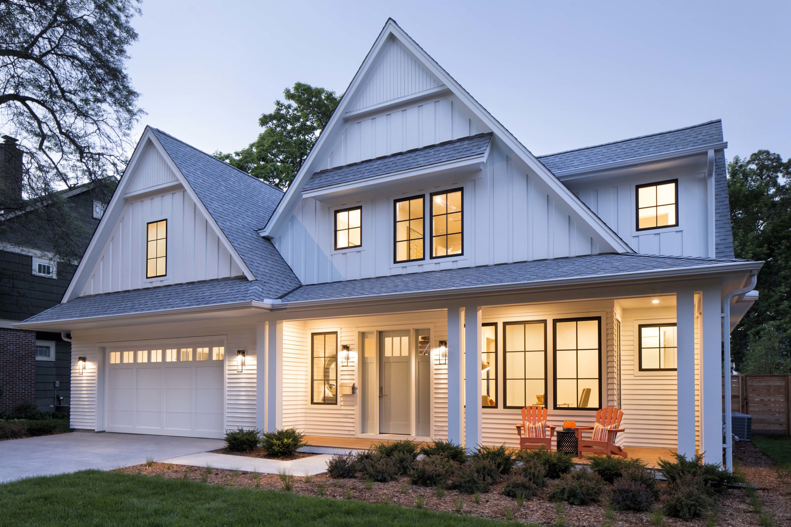 A white home with a large front porch.