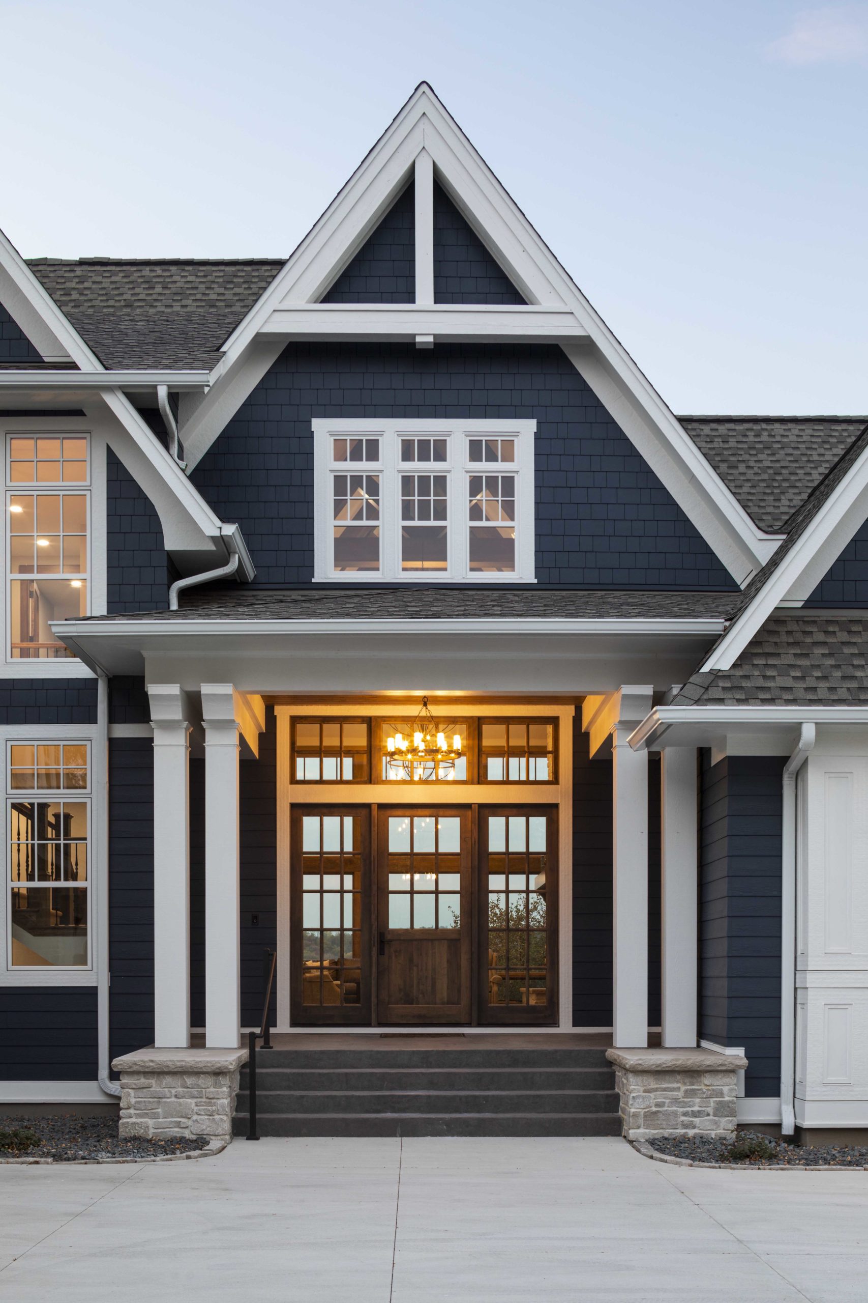Get inspired by this blue home with white trim, perfect for your exterior design ideas.