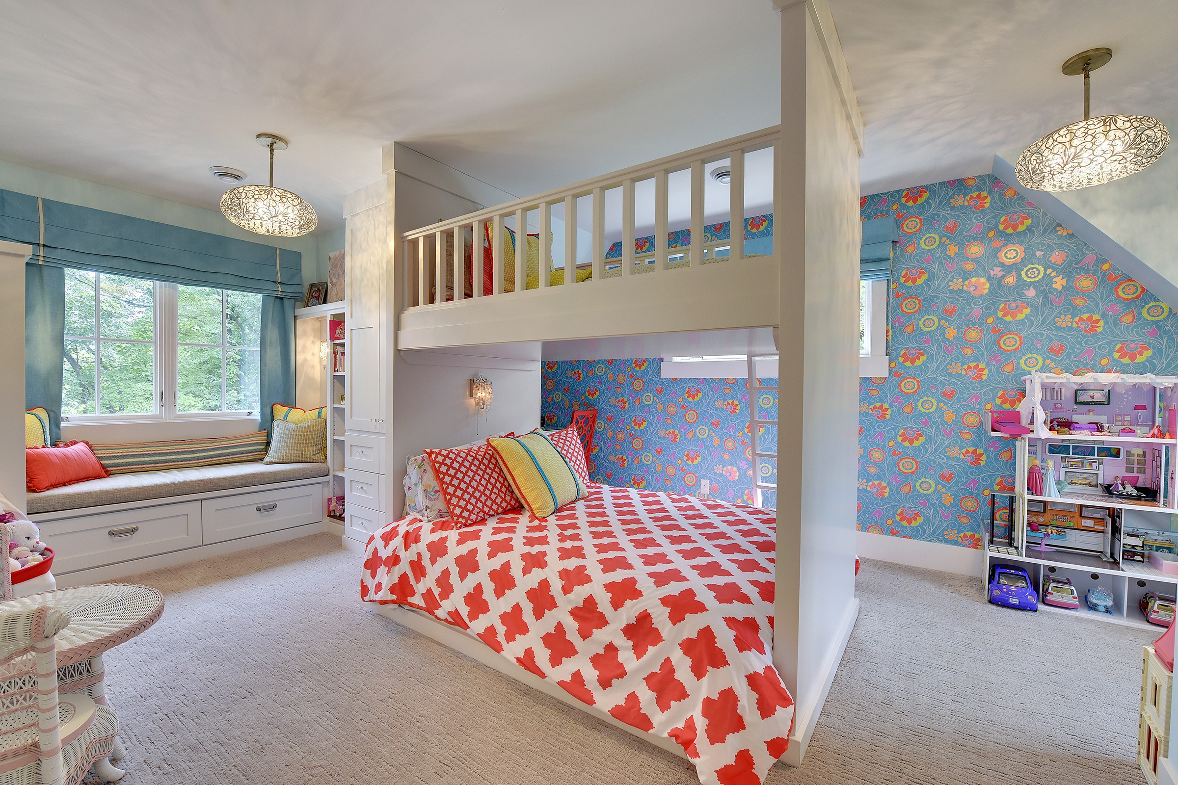Bright springlike colored child's bedroom with white bunkbeds situated in the middle of the room.
