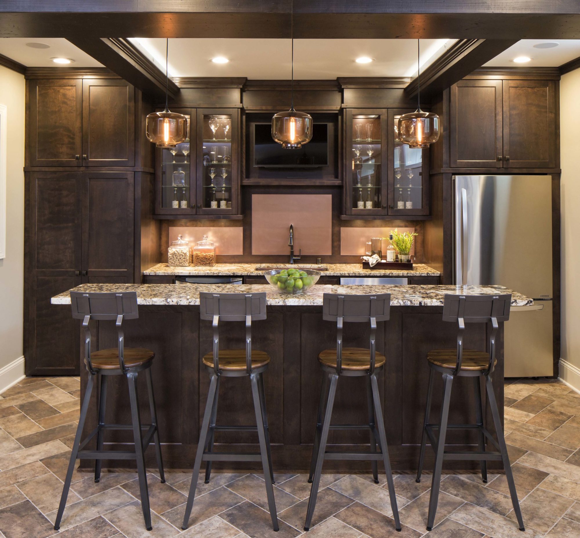 An Edina remodel kitchen with a center island and bar stools.