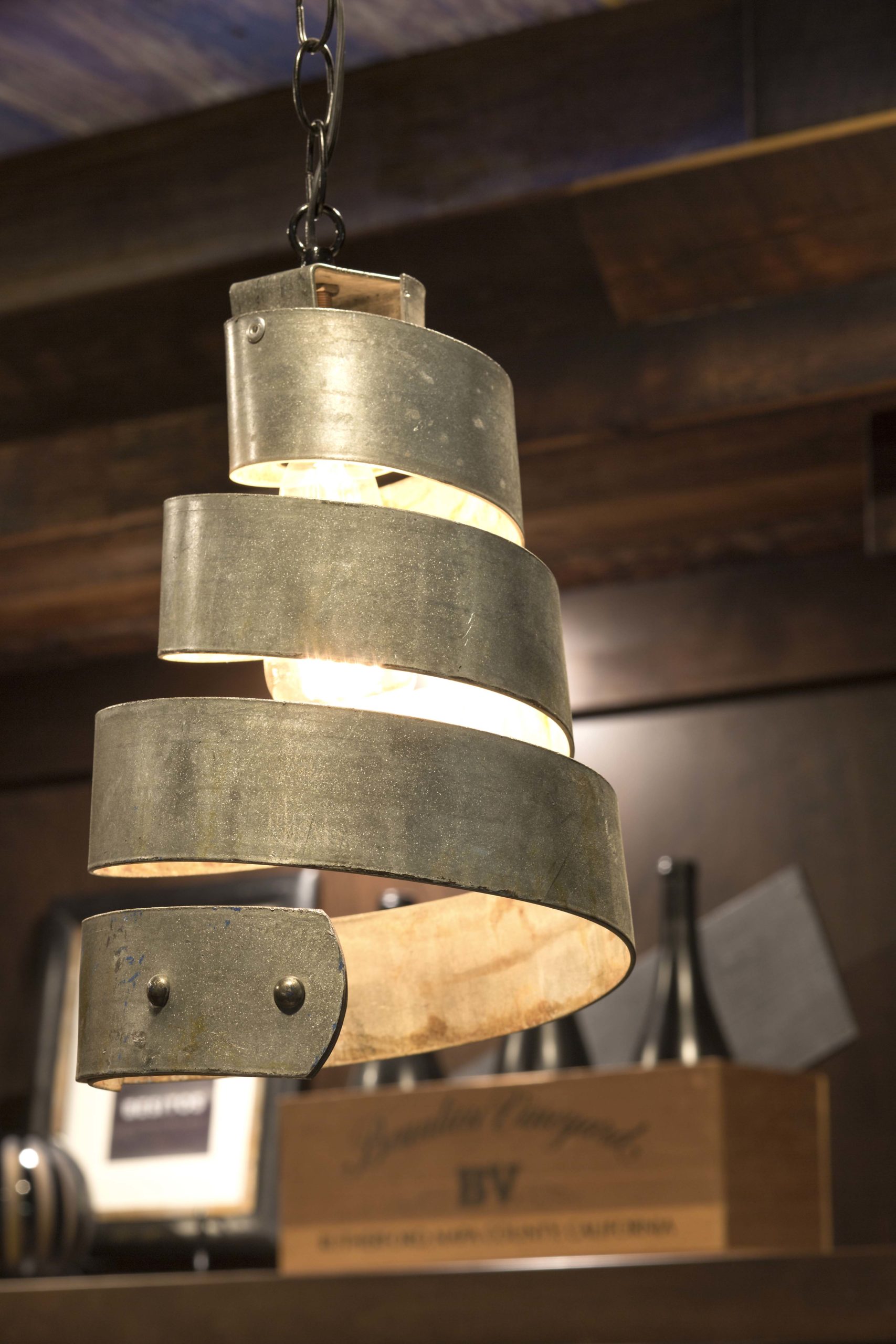An Edina remodel wine barrel pendant light hanging in a room.