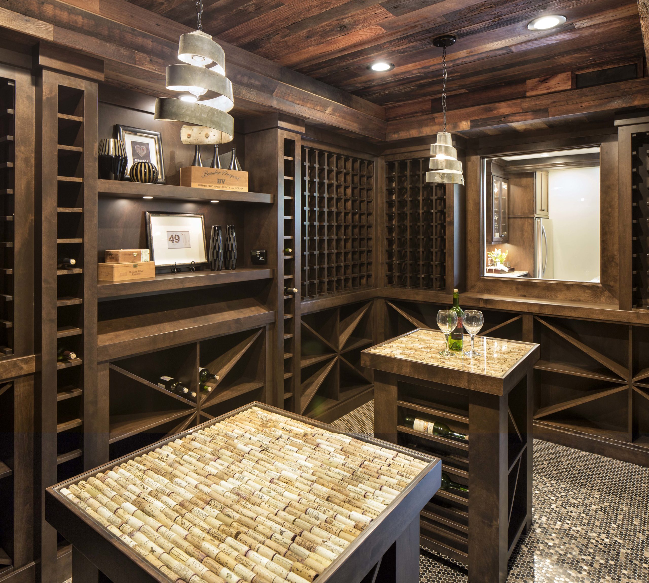An Edina remodel featuring a wine cellar with elegant wooden shelves and a functional table.