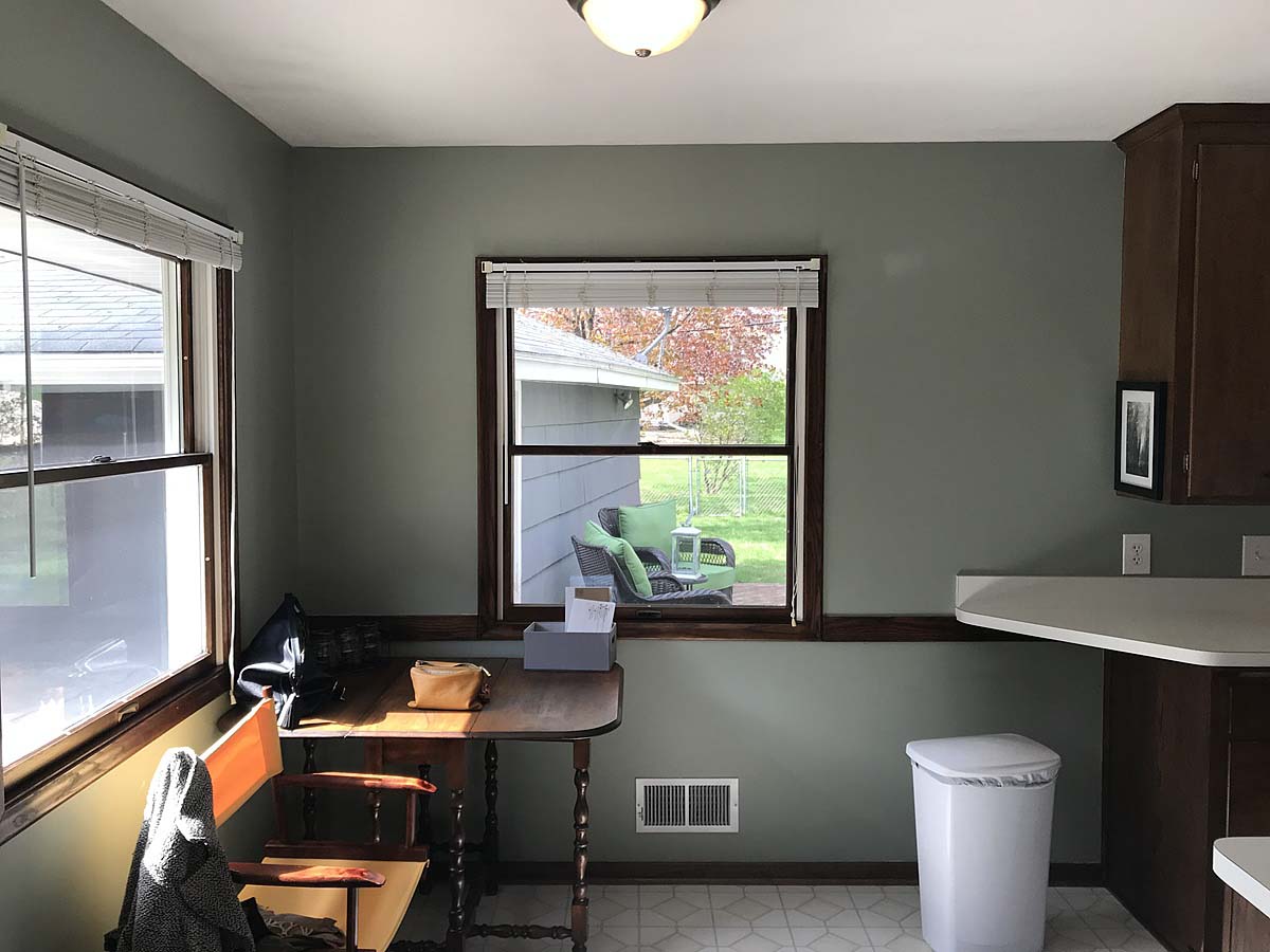 A small kitchen remodel with a window and a desk.