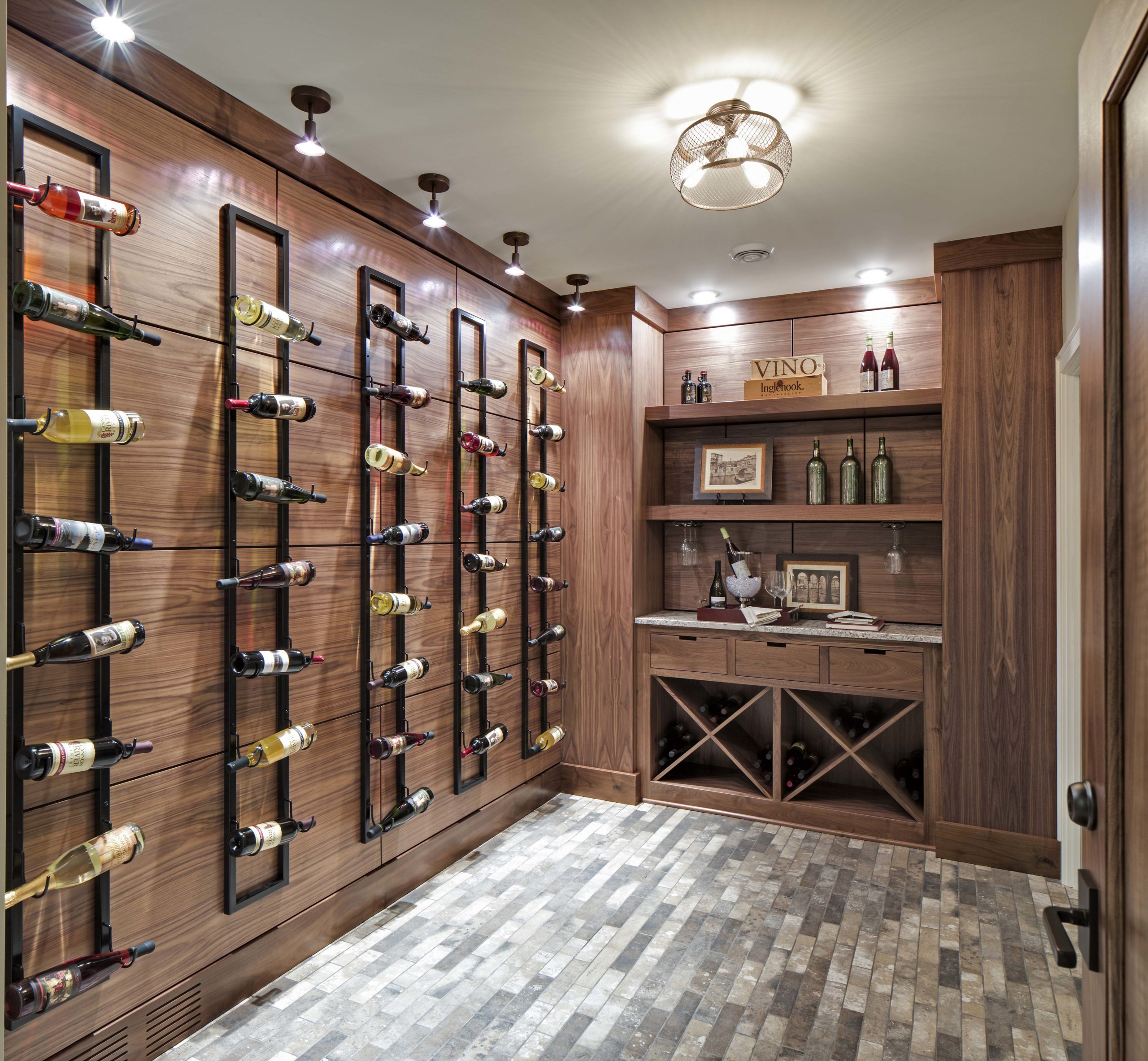 A wine cellar with a wall of wine bottles.