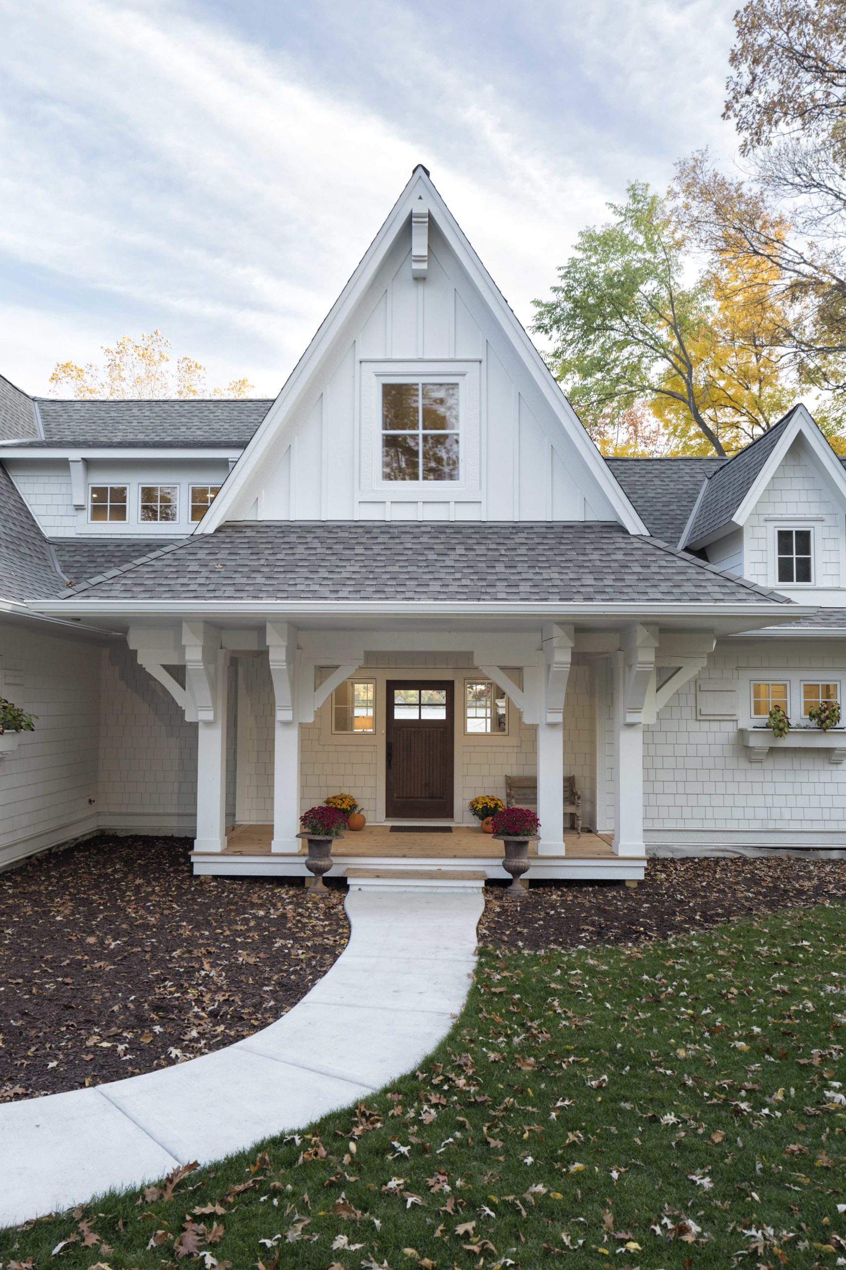 A white home with a front porch.