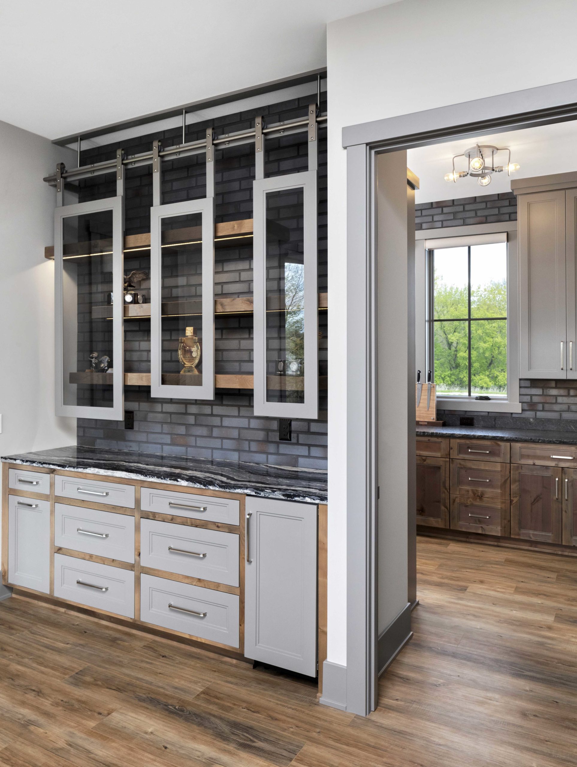 A kitchen with a sliding barn door.