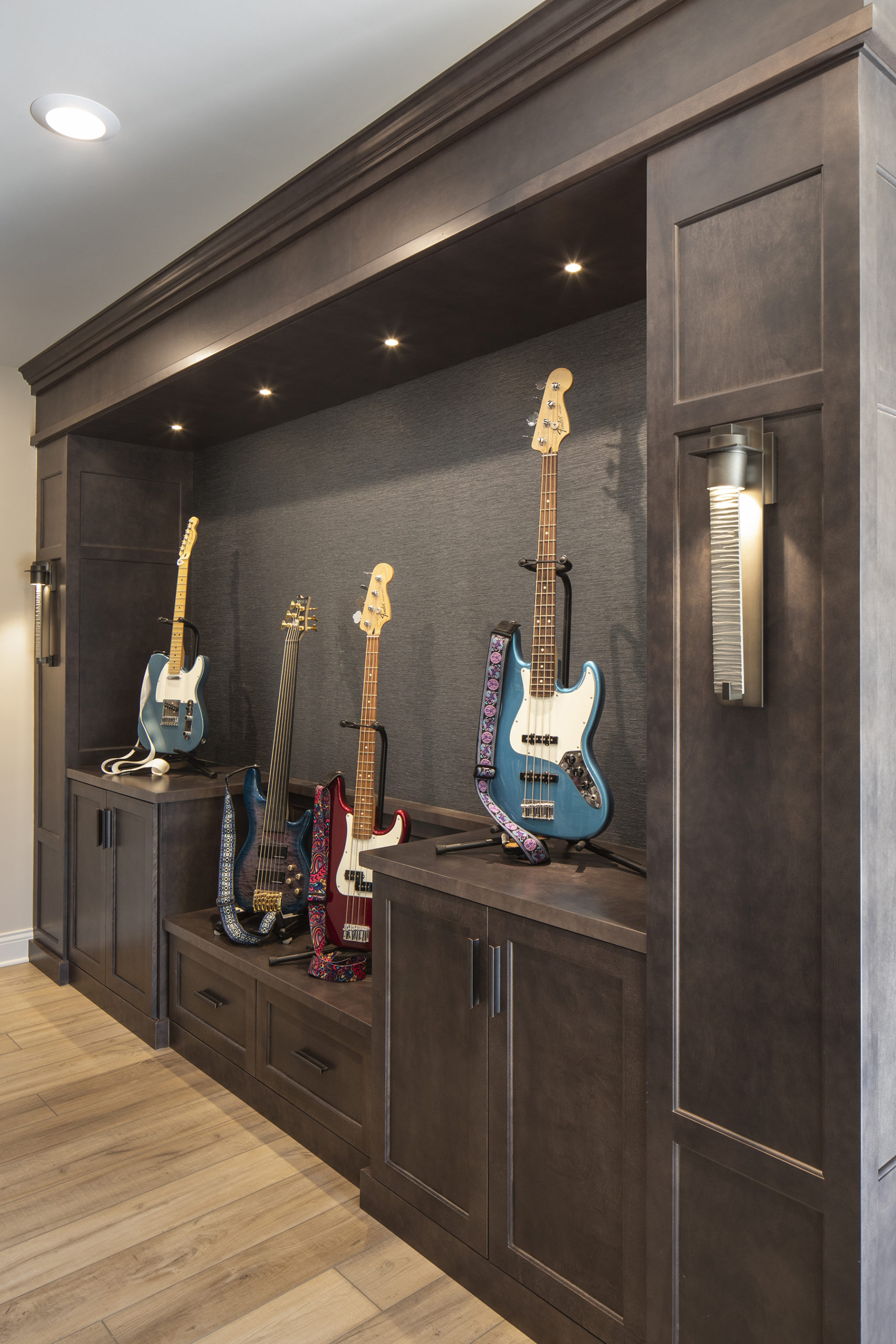         Description: A custom home build featuring a stylish room with several guitars on display.