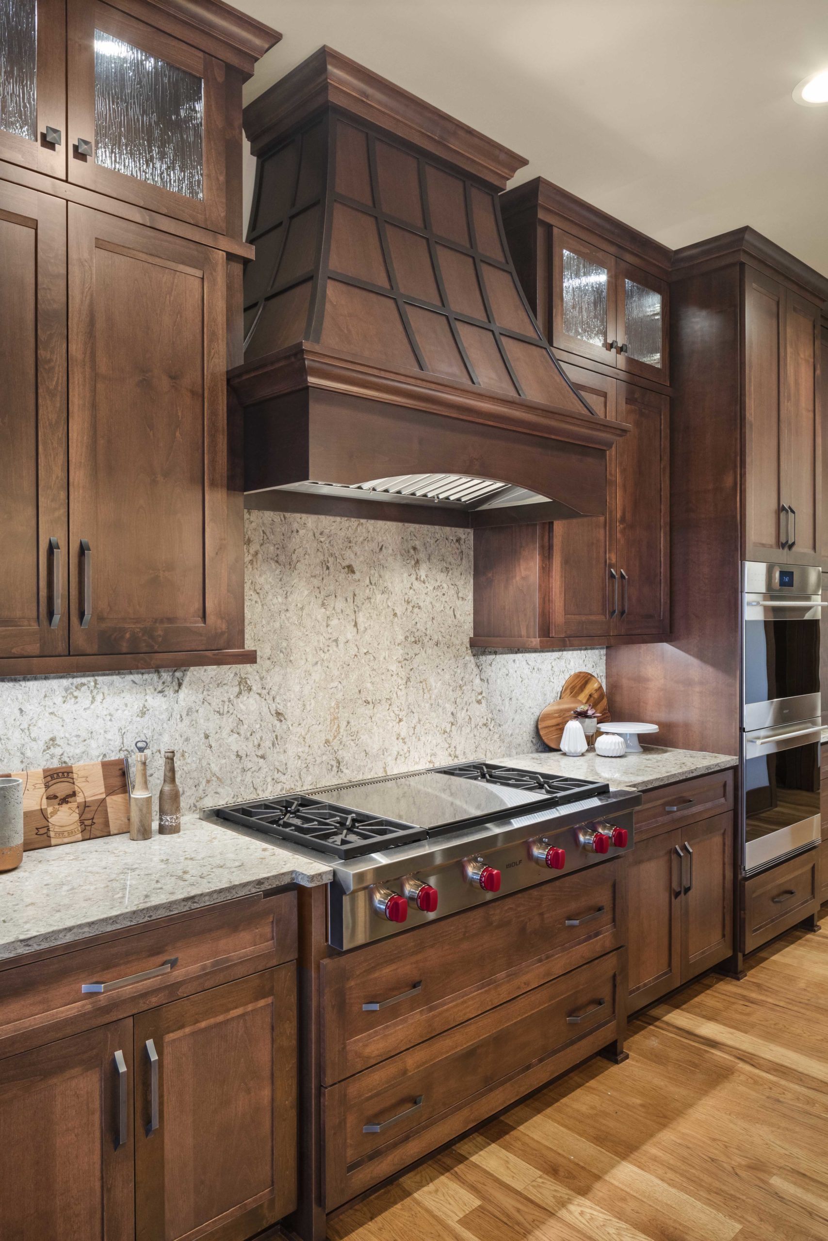 A custom home remodel with a kitchen featuring wood cabinets and granite counter tops.