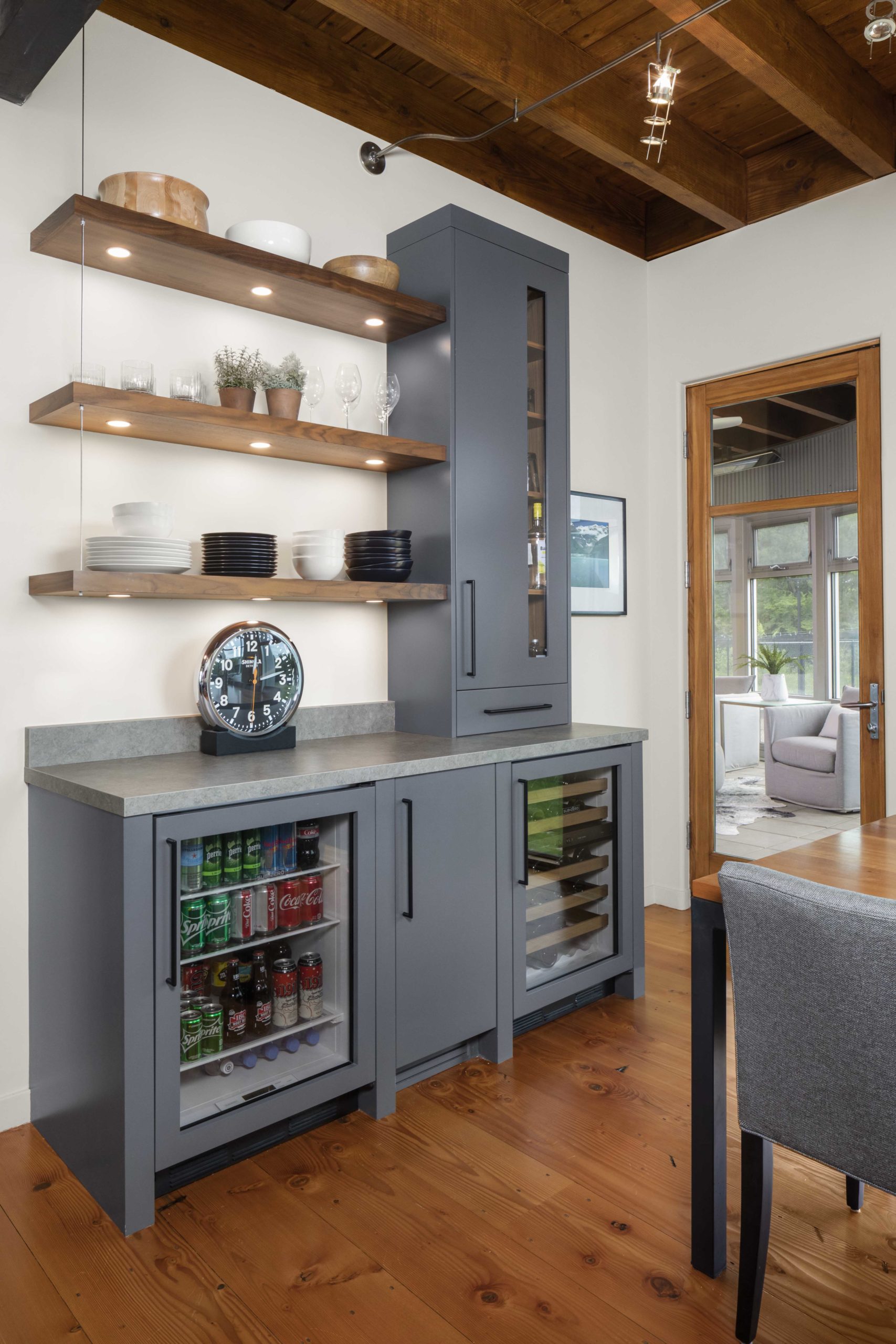 A contemporary kitchen with a refrigerator and a table.