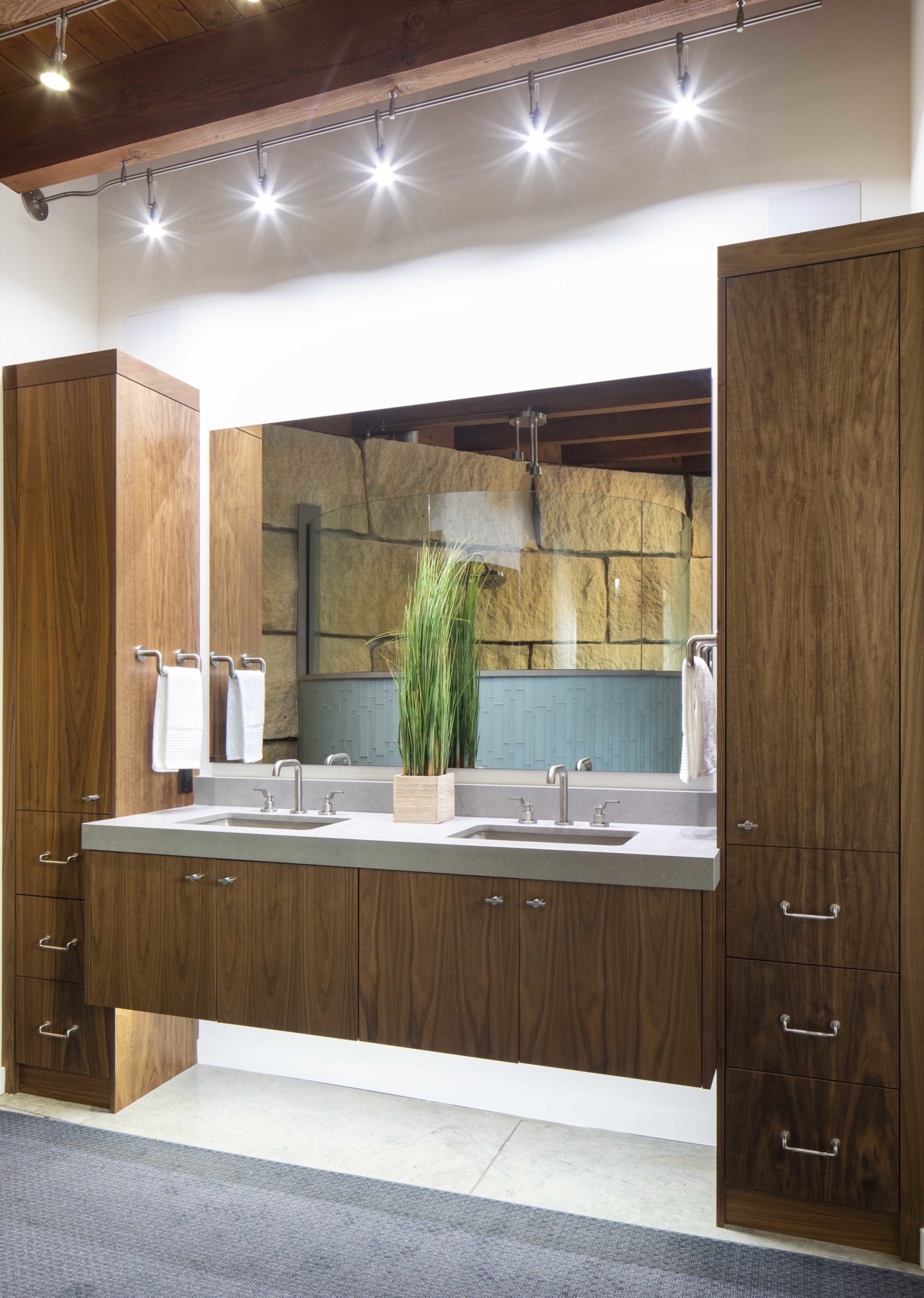 A contemporary bathroom with two sinks and a mirror.