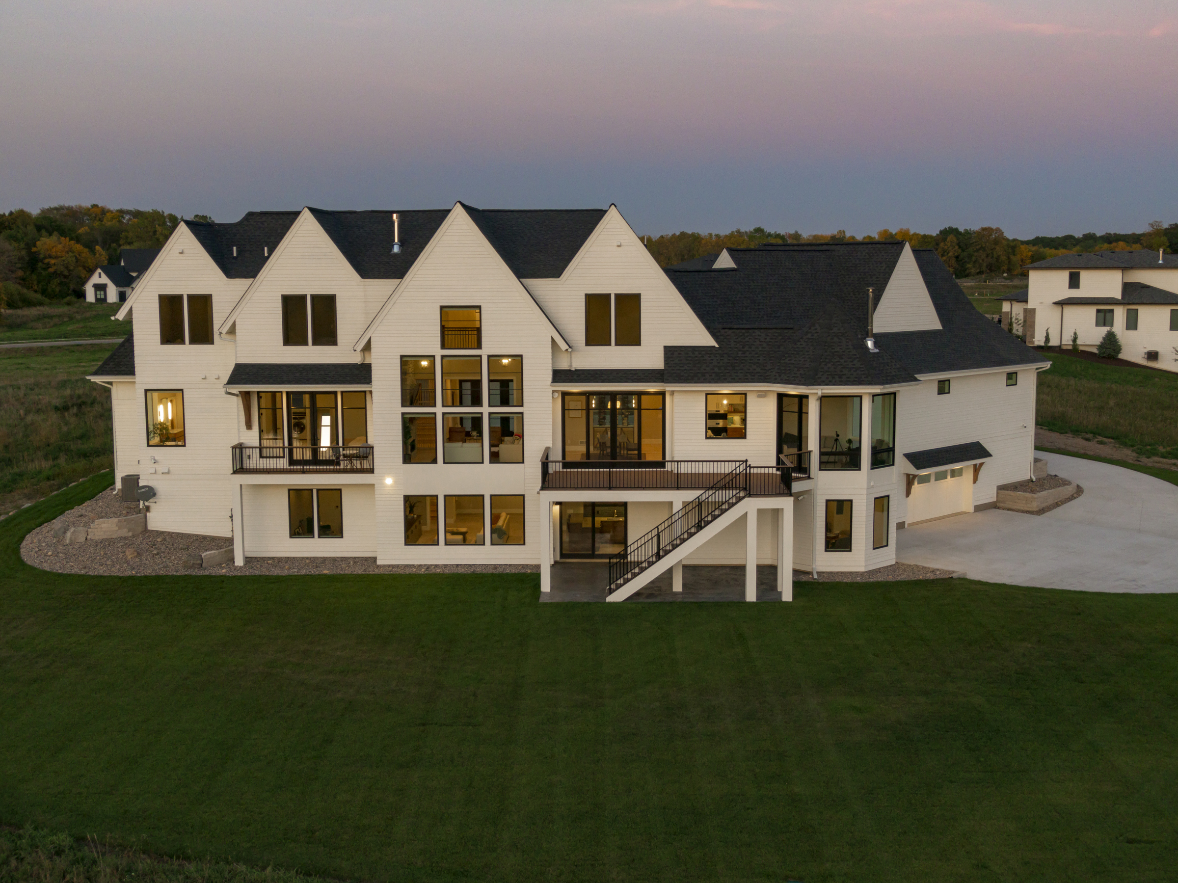 An aerial view of a prairie transitional custom home in the countryside.
