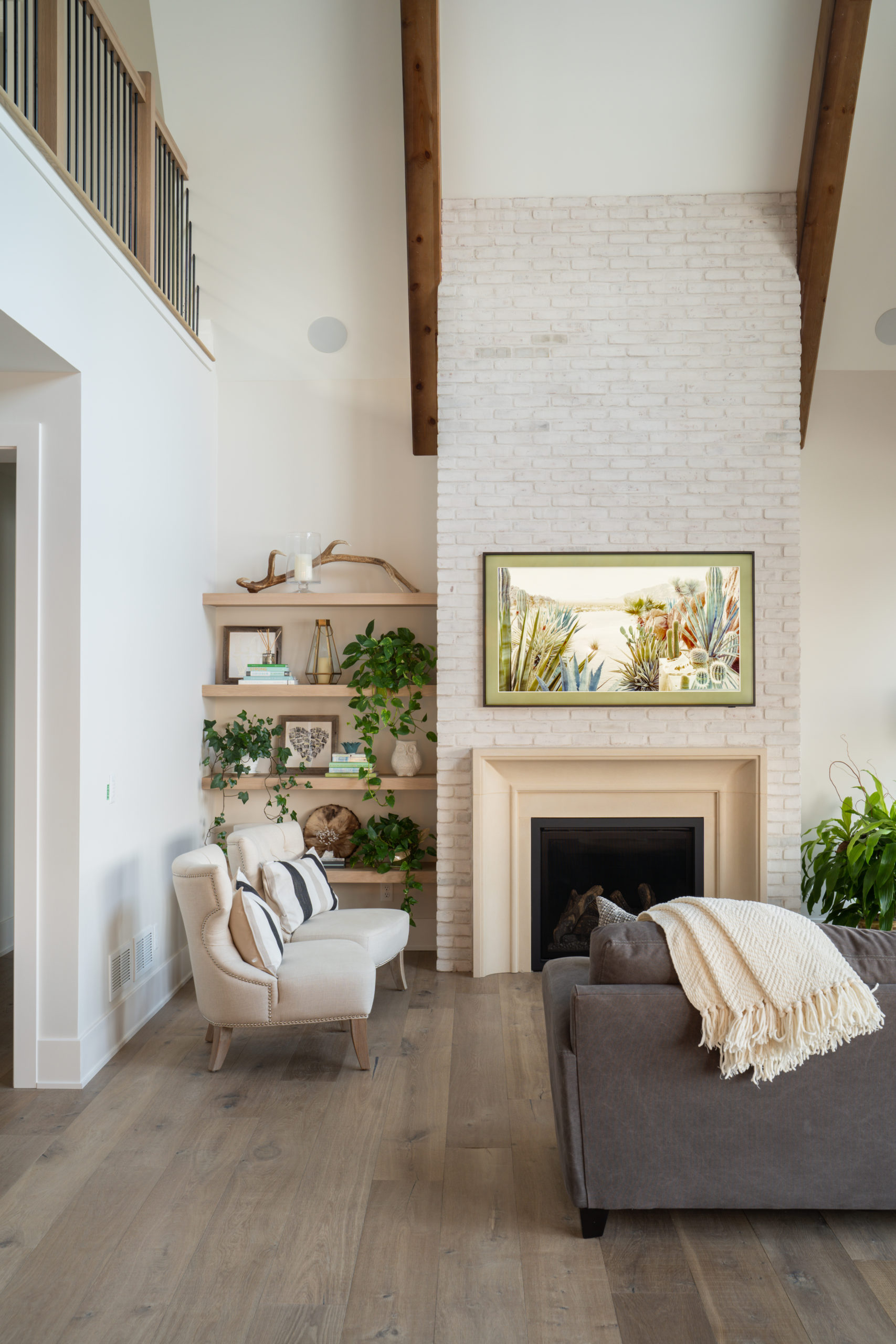 The Lake Escape custom home remodel includes a cozy living room with a fireplace.