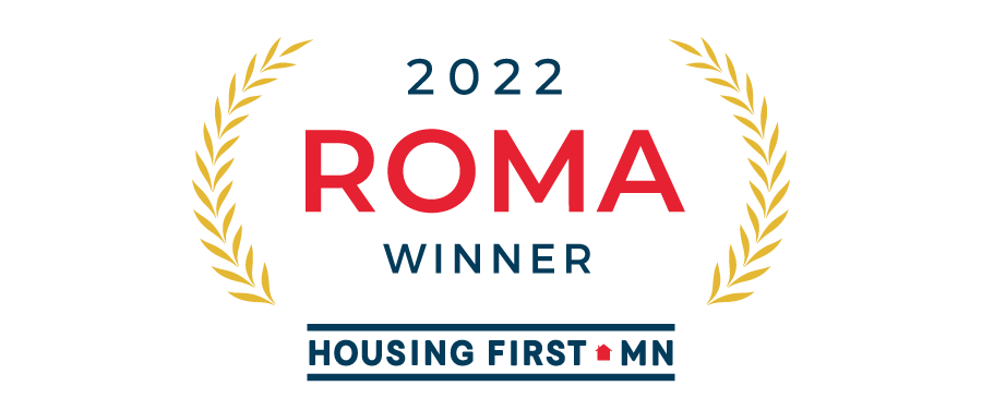 The logo for the 2020 Roma Winner Housing First, featuring elements inspired by "The Lake Escape" custom home remodel.