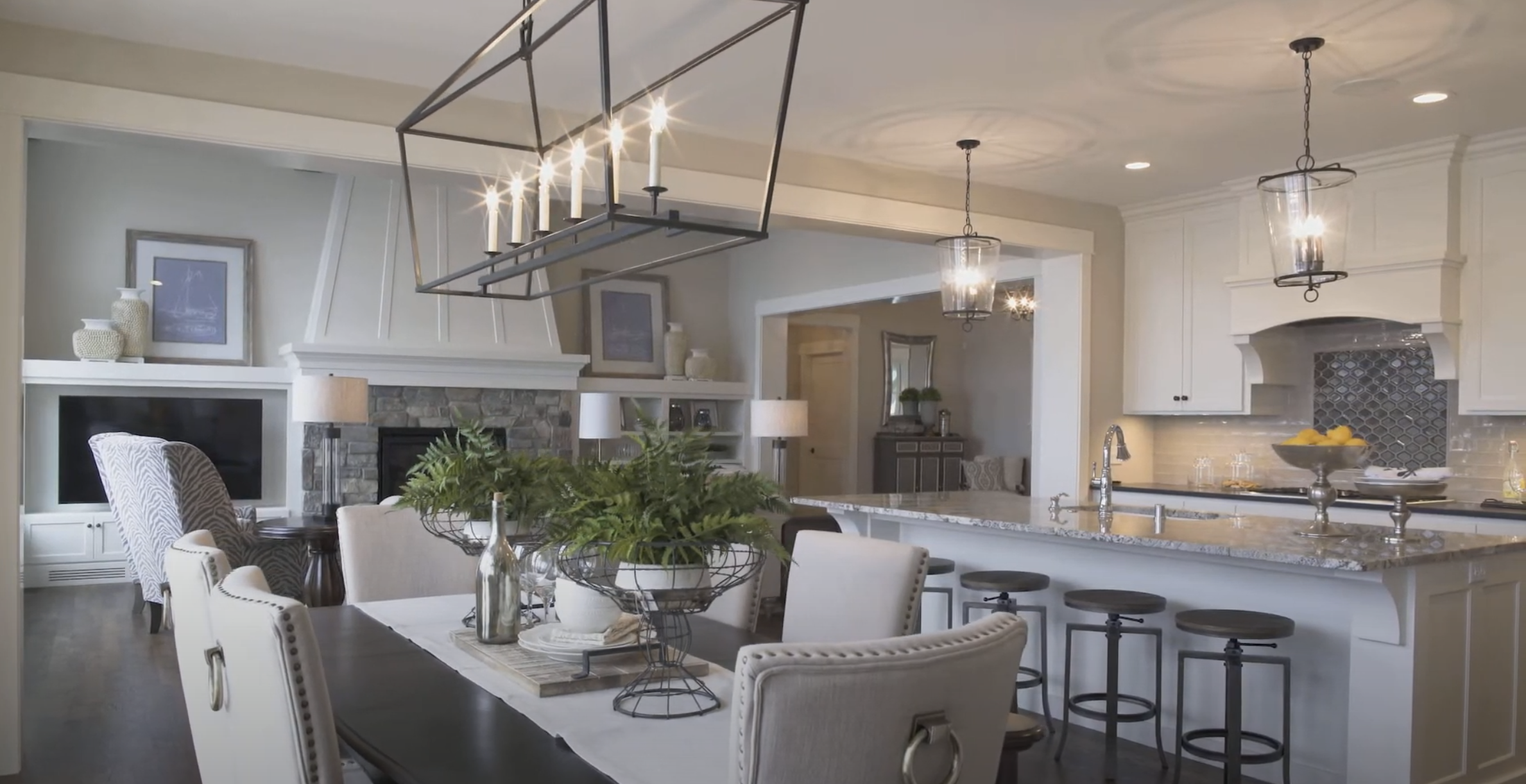 A large kitchen with a dining table and chairs is featured in this Custom Home Build Video Series.