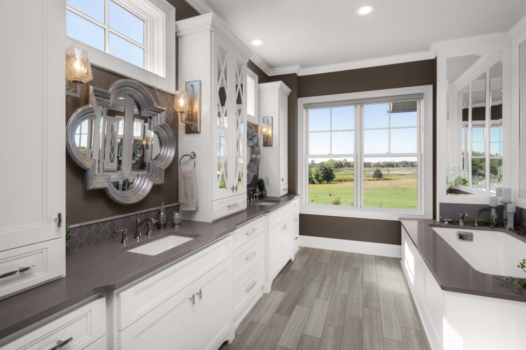 A prairie-inspired bathroom with a large window.