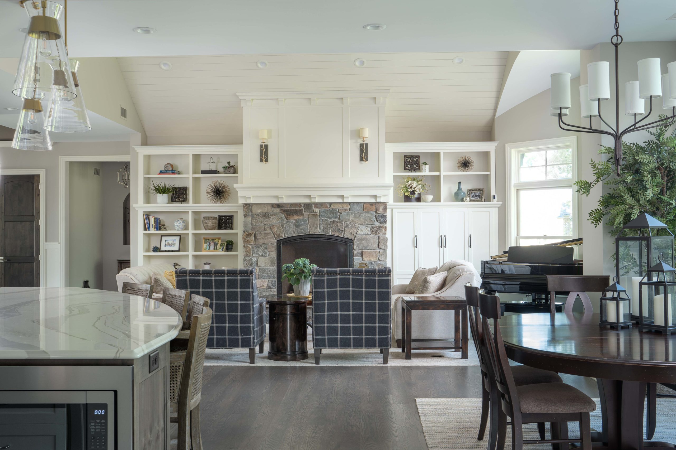 The Lake Escape custom home remodel includes a kitchen with a dining table and chairs.
