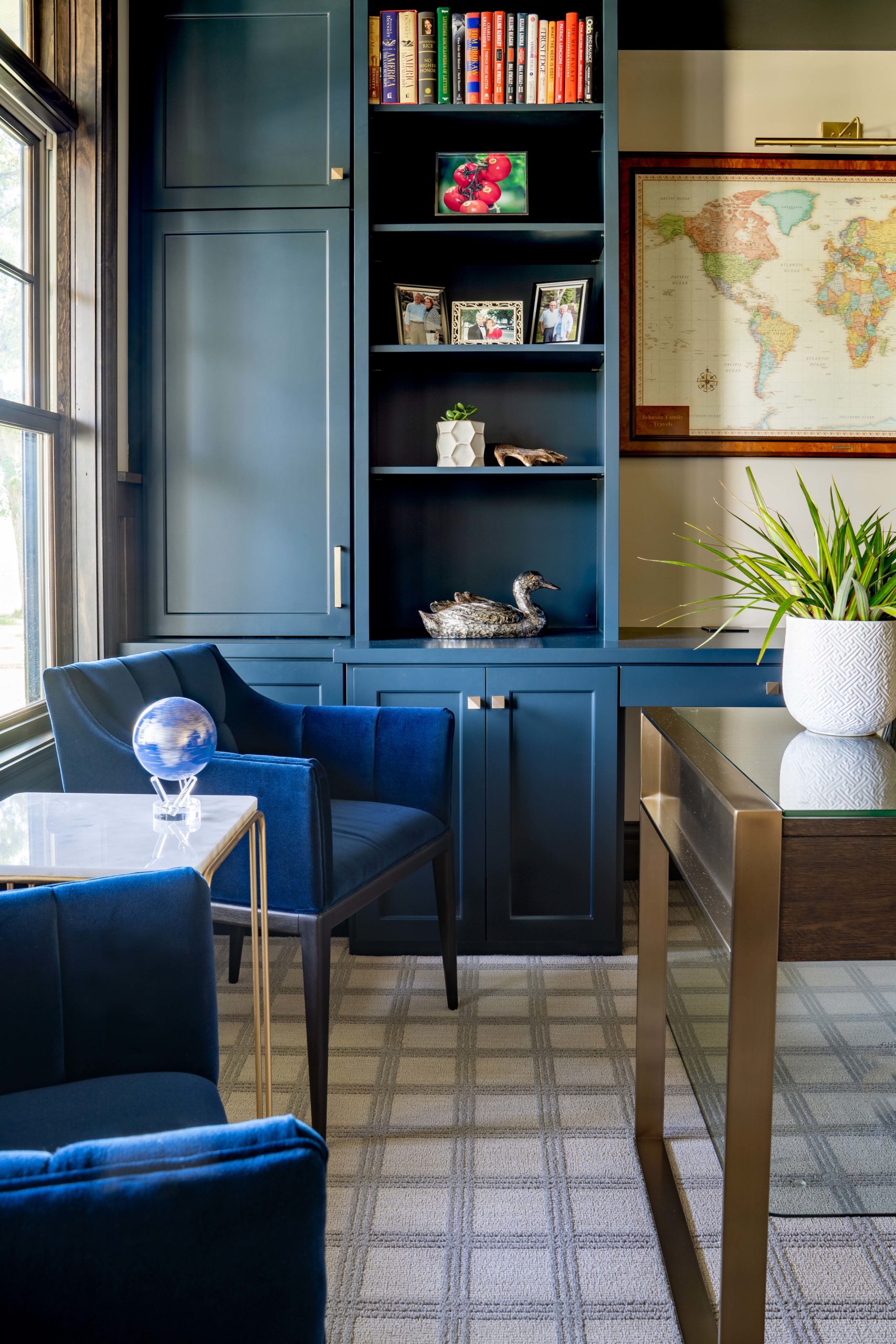 A blue chair in a home office, part of The Lake Escape custom home remodel.