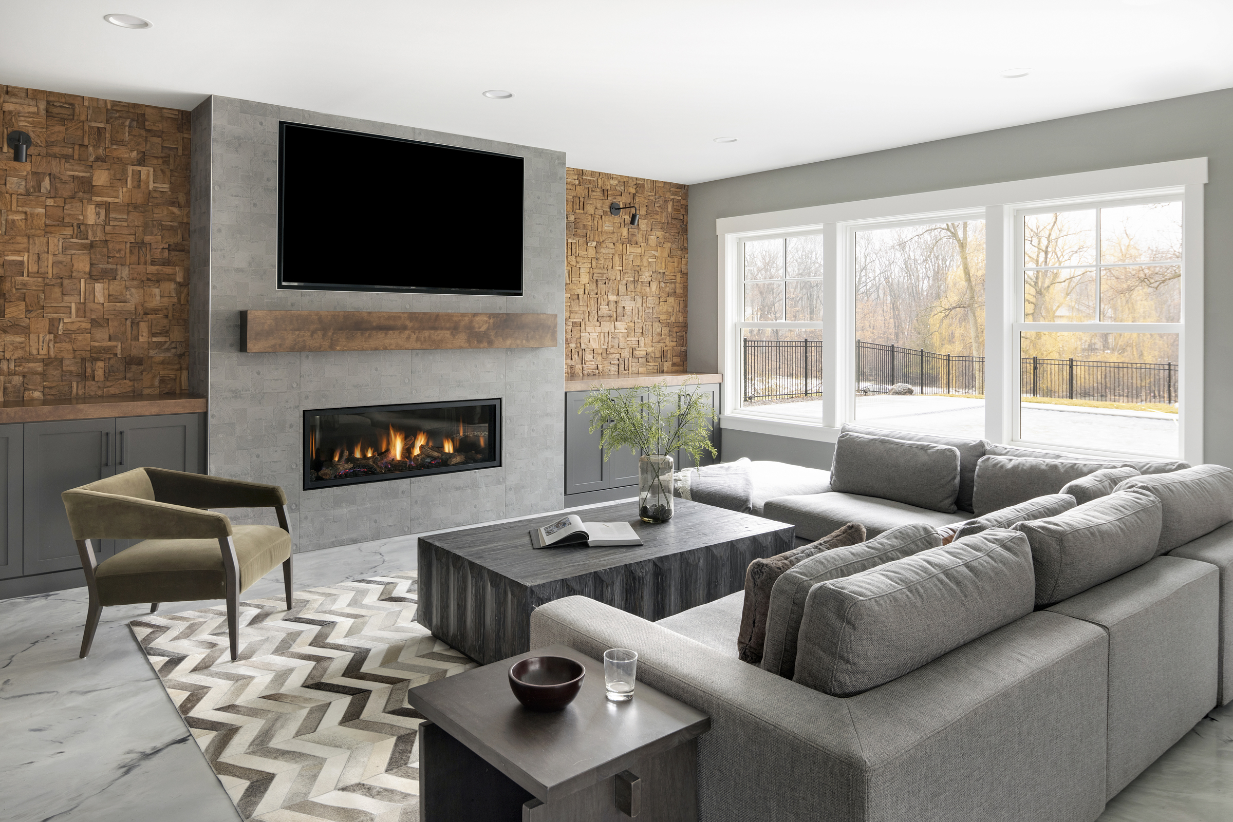 A modern living room with a fireplace and tv.