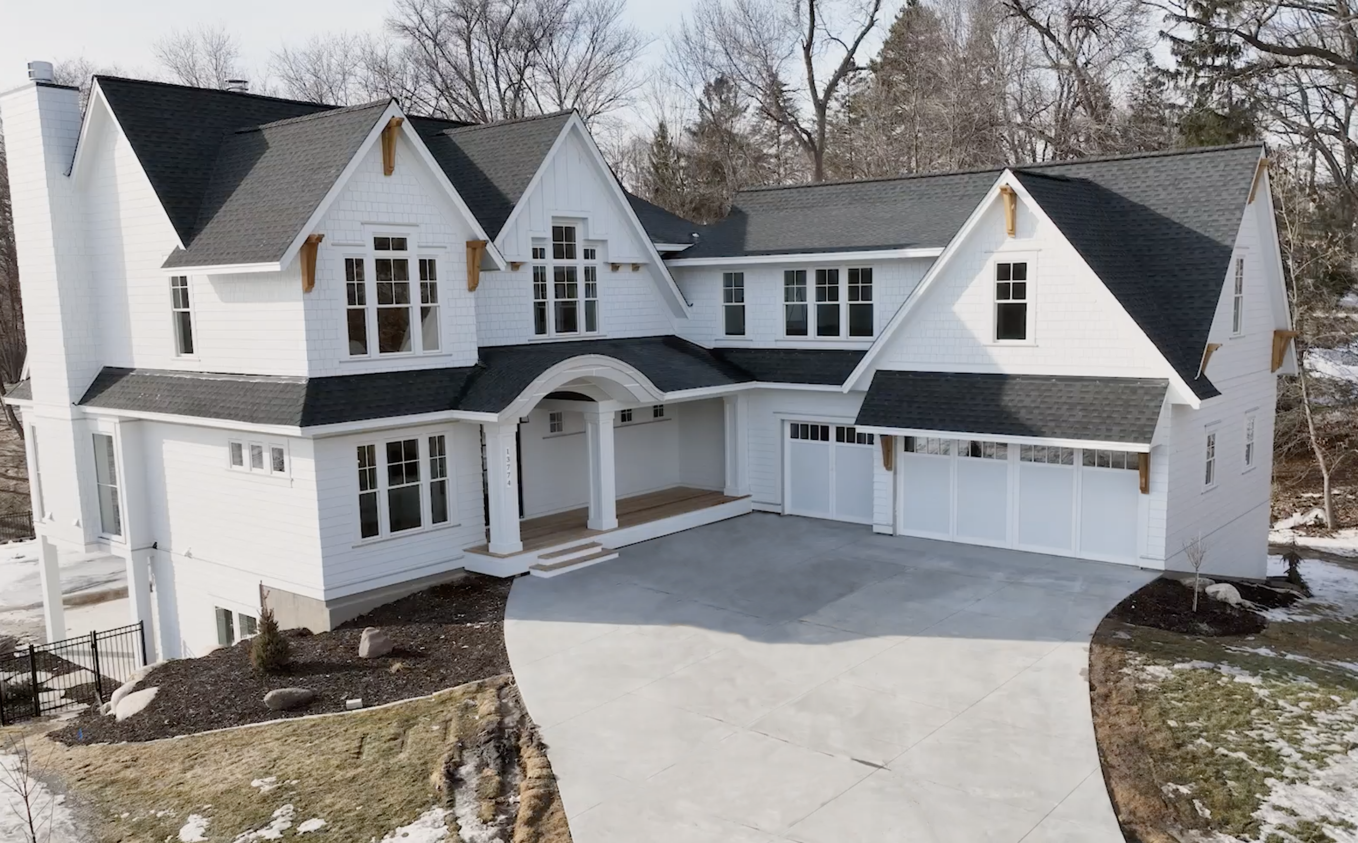An aerial view of a Minnetonka dream home in the snow.
