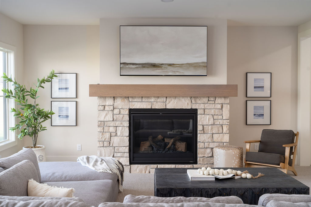 A prairie transitional living room with a stone fireplace.