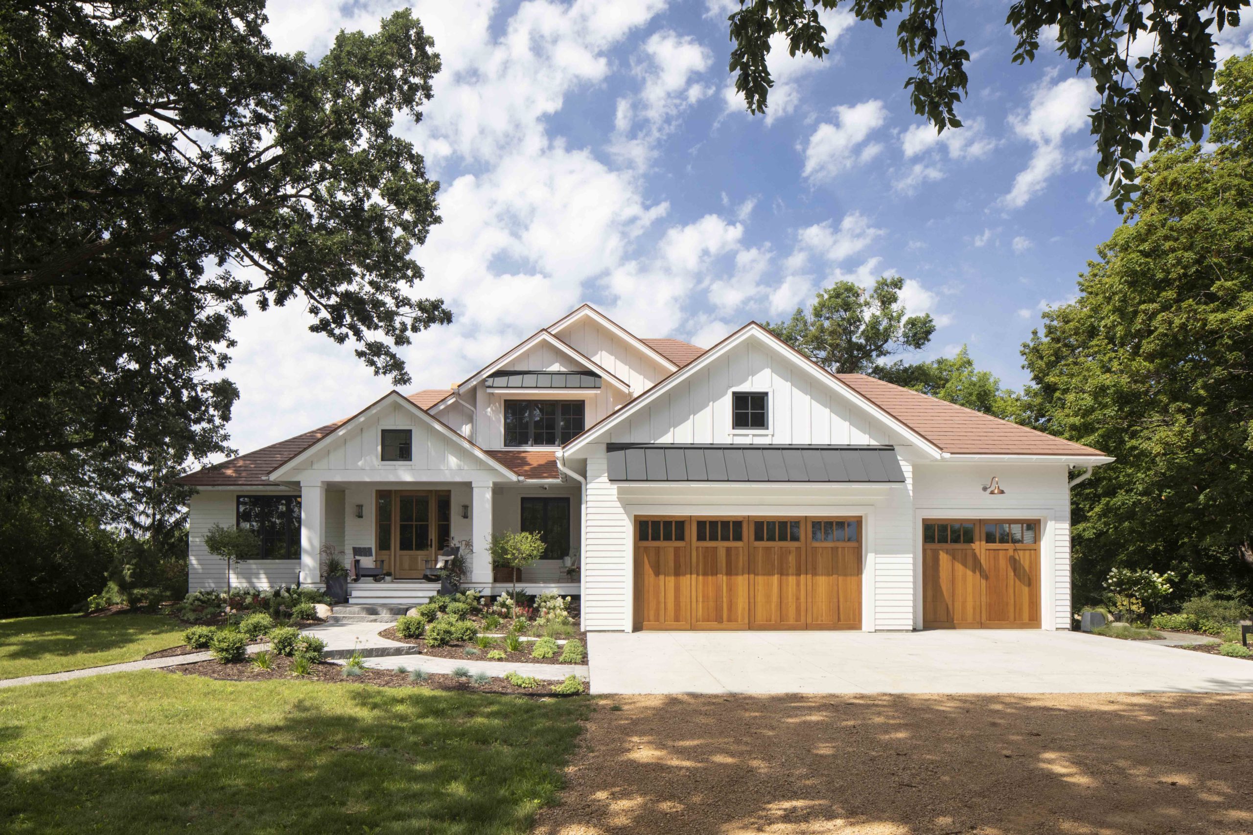 A prairie-style home with a white garage.
