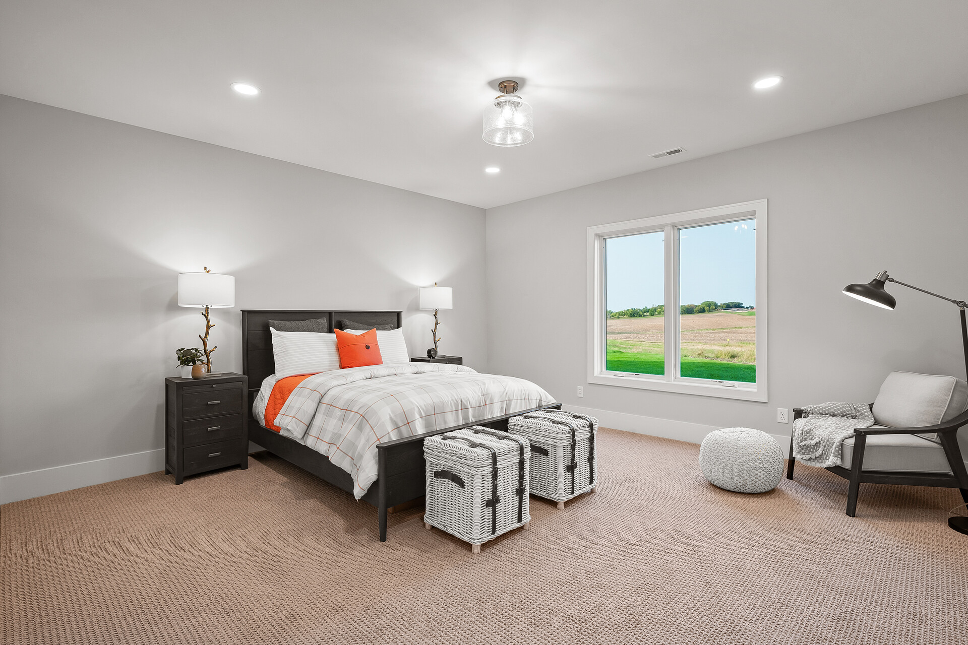 A prairie transitional custom home with gray walls and orange accents.