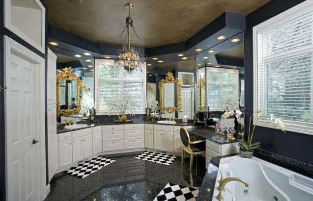 A modern bathroom remodel with a black and white checkered floor.