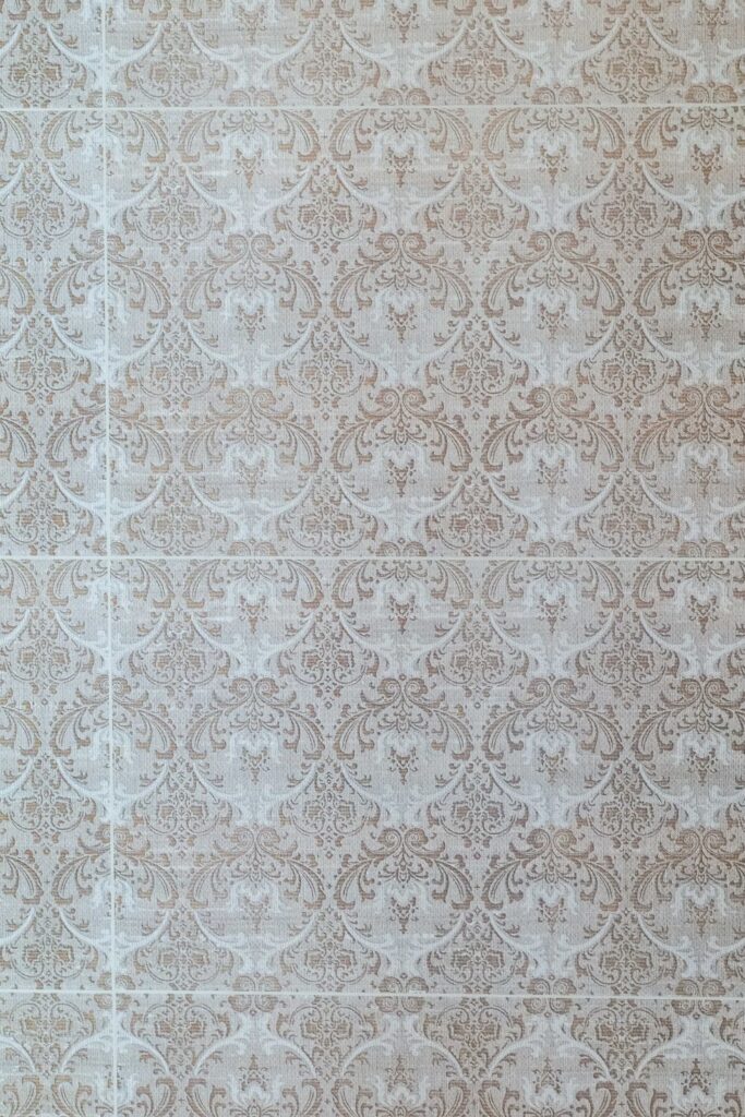 A white and beige damask pattern on a white background, perfect for a Modern Tuscan Mediterranean home.