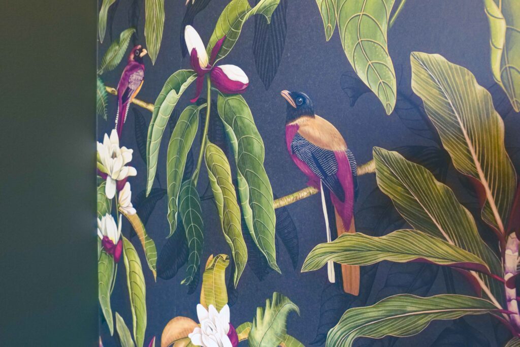 A modern wallpaper with birds and flowers on it, perfect for a Tuscan-inspired Mediterranean home.