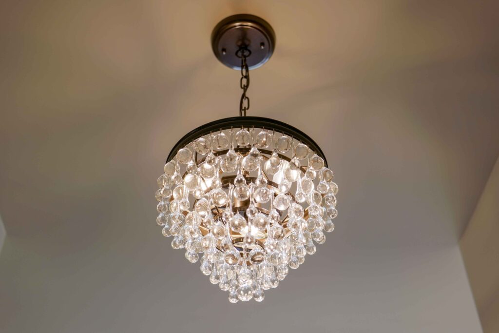 A crystal chandelier hanging in a Modern Tuscan home.