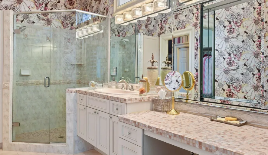 A woodside bathroom remodel with floral wallpaper and a glass shower in Minnetonka.