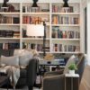 An Orchard Lake remodel featuring a living room with bookshelves.