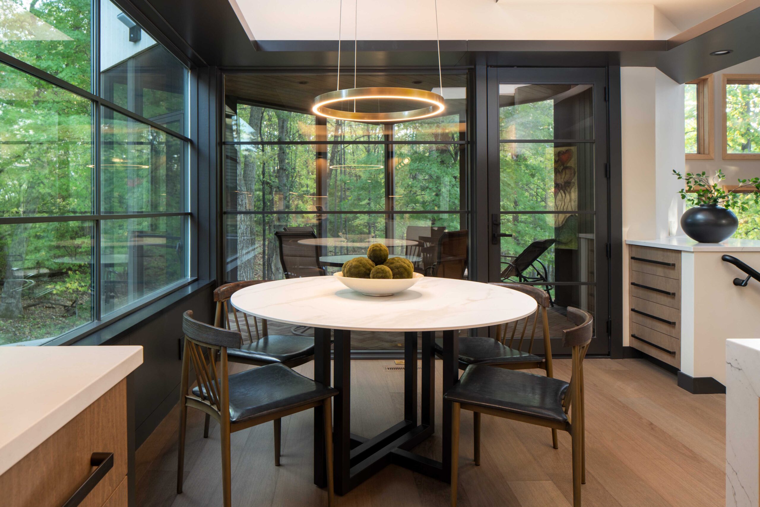 A modern kitchen with a dining table and chairs in Bloomington.