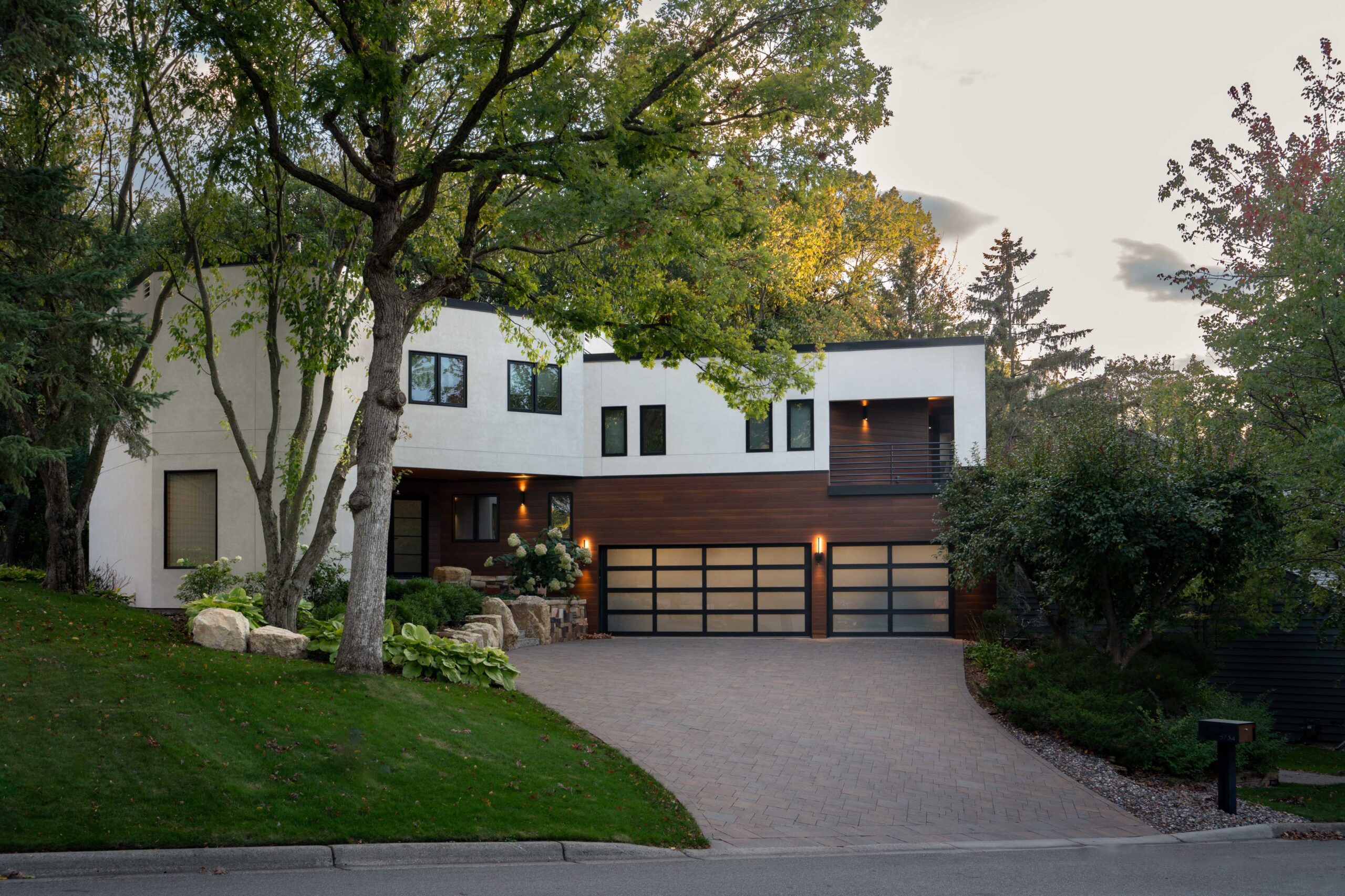 A modern home with a driveway and trees in Bloomington.