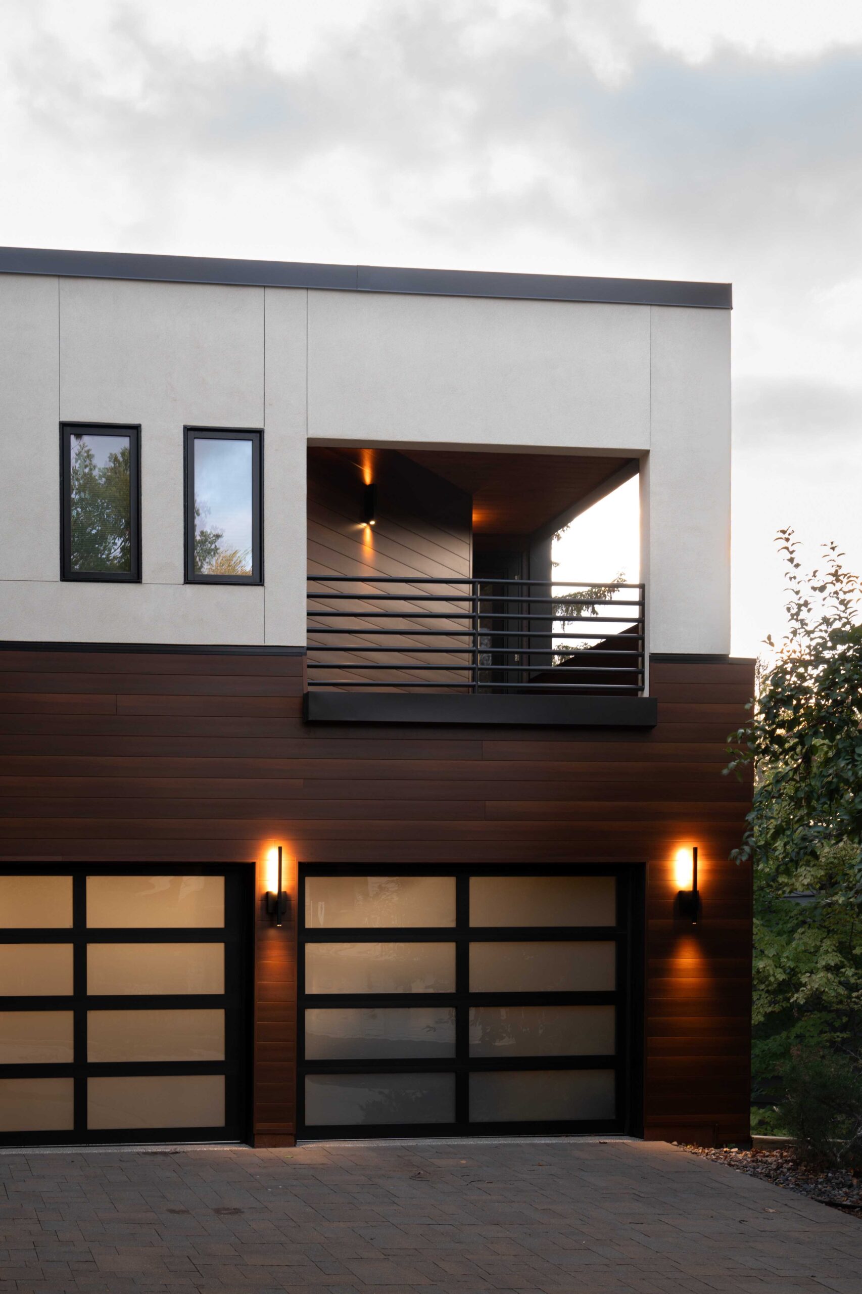 A modern Bloomington remodel with two garage doors.