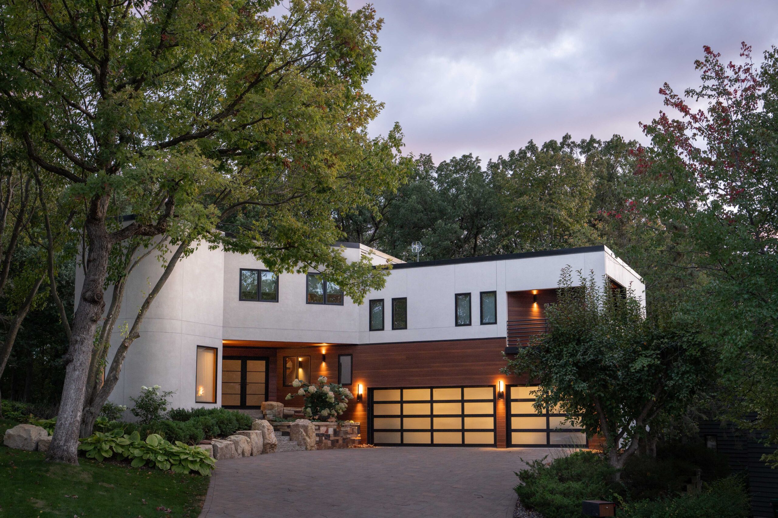 A modern home with trees.