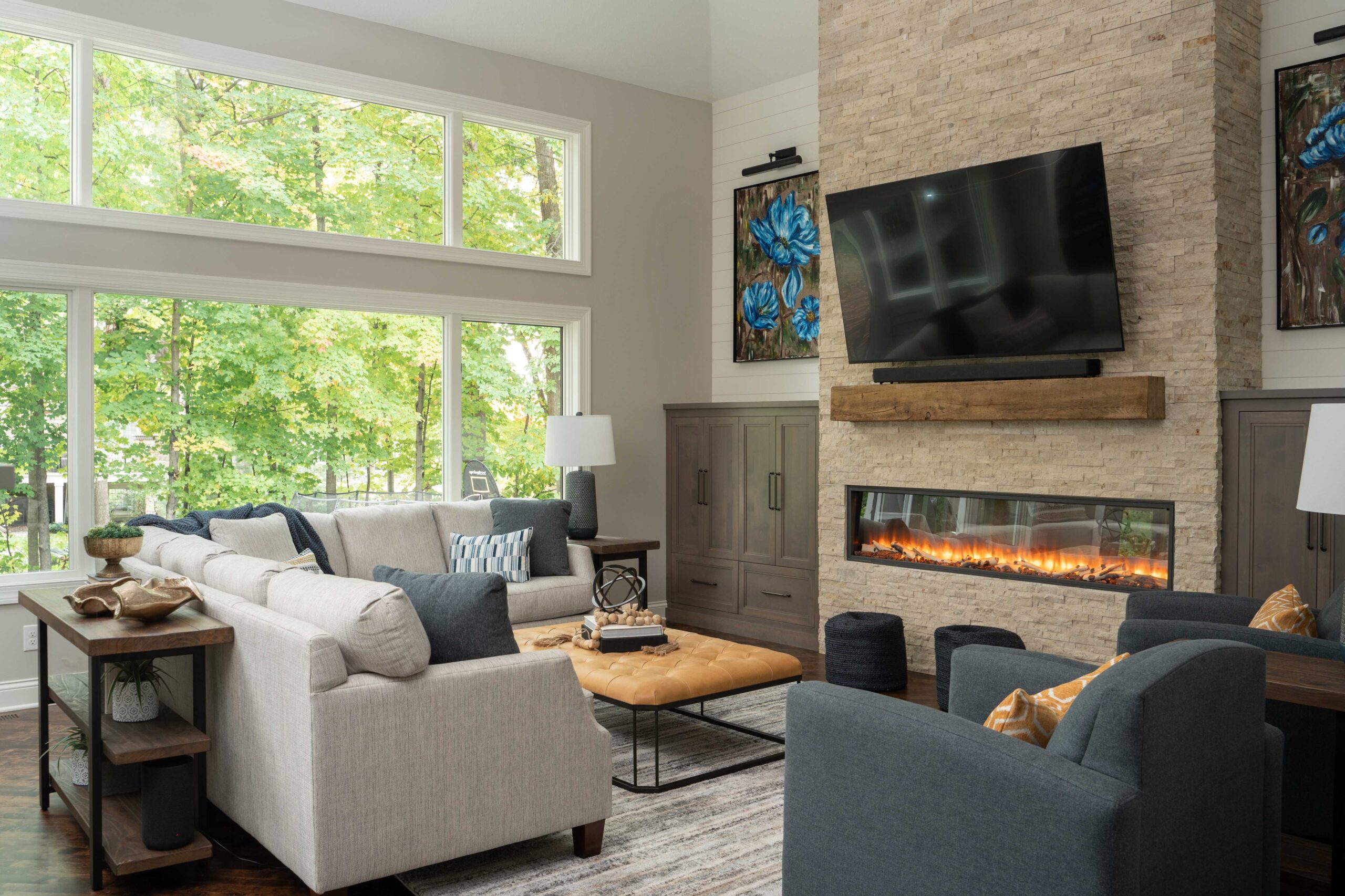 Great Waters Alcove Remodel: A cozy living room with a fireplace and TV.
