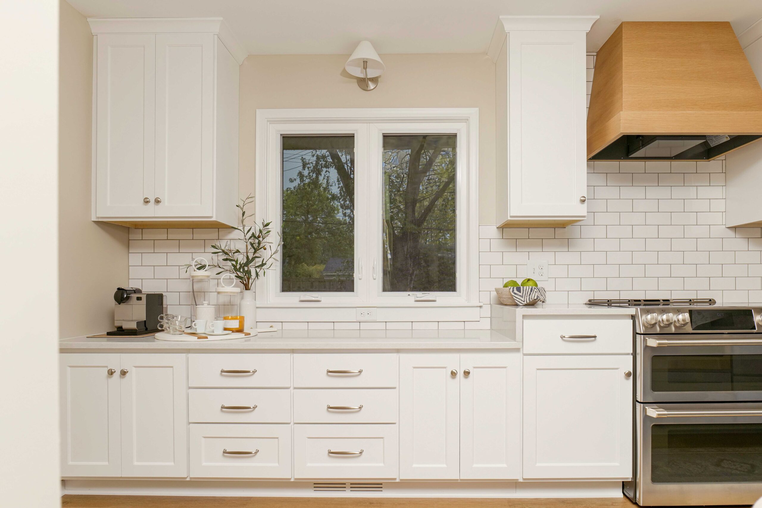 A coastal style kitchen remodel with a white stove and oven.
